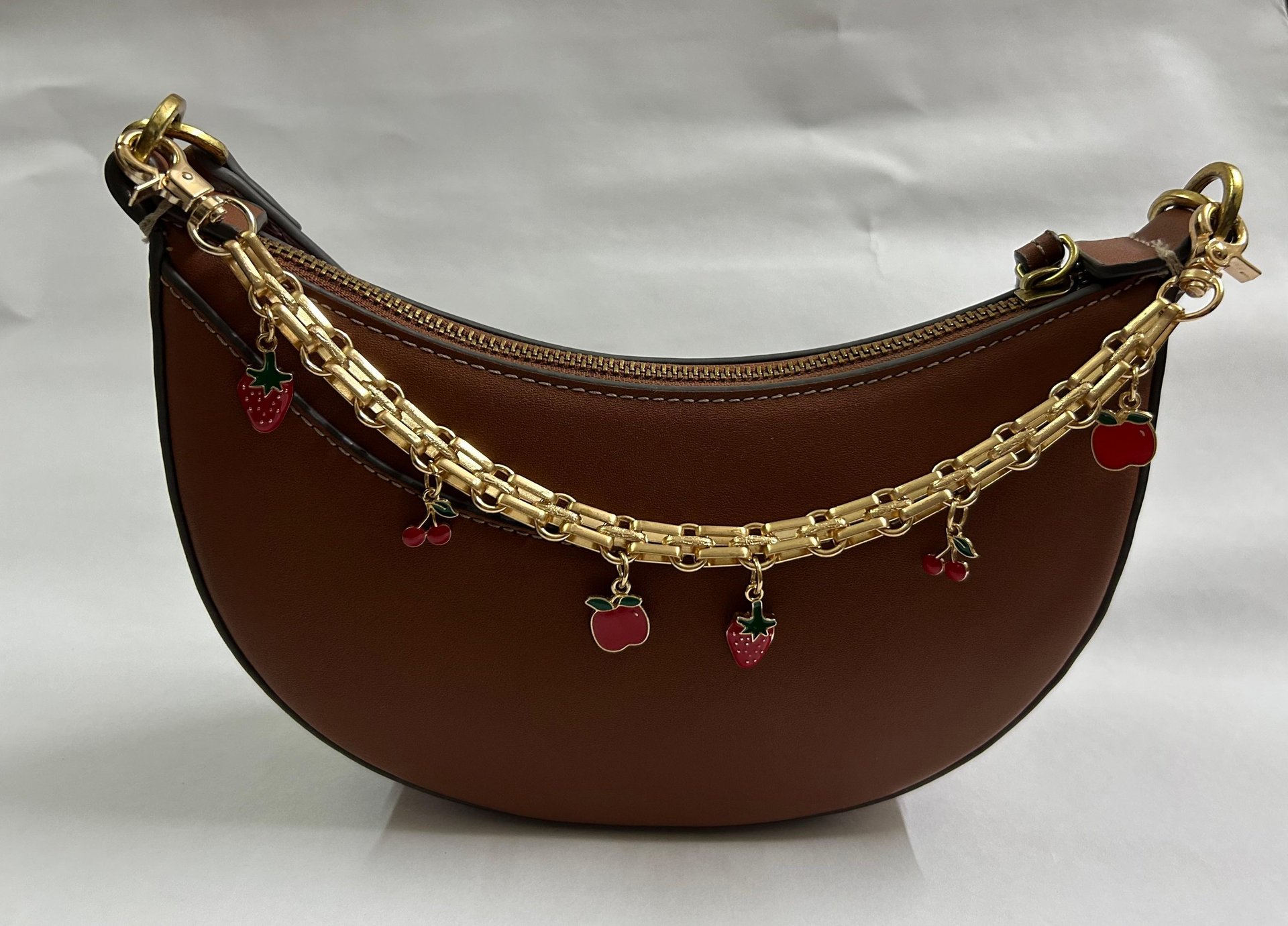 a gold chain with a black band