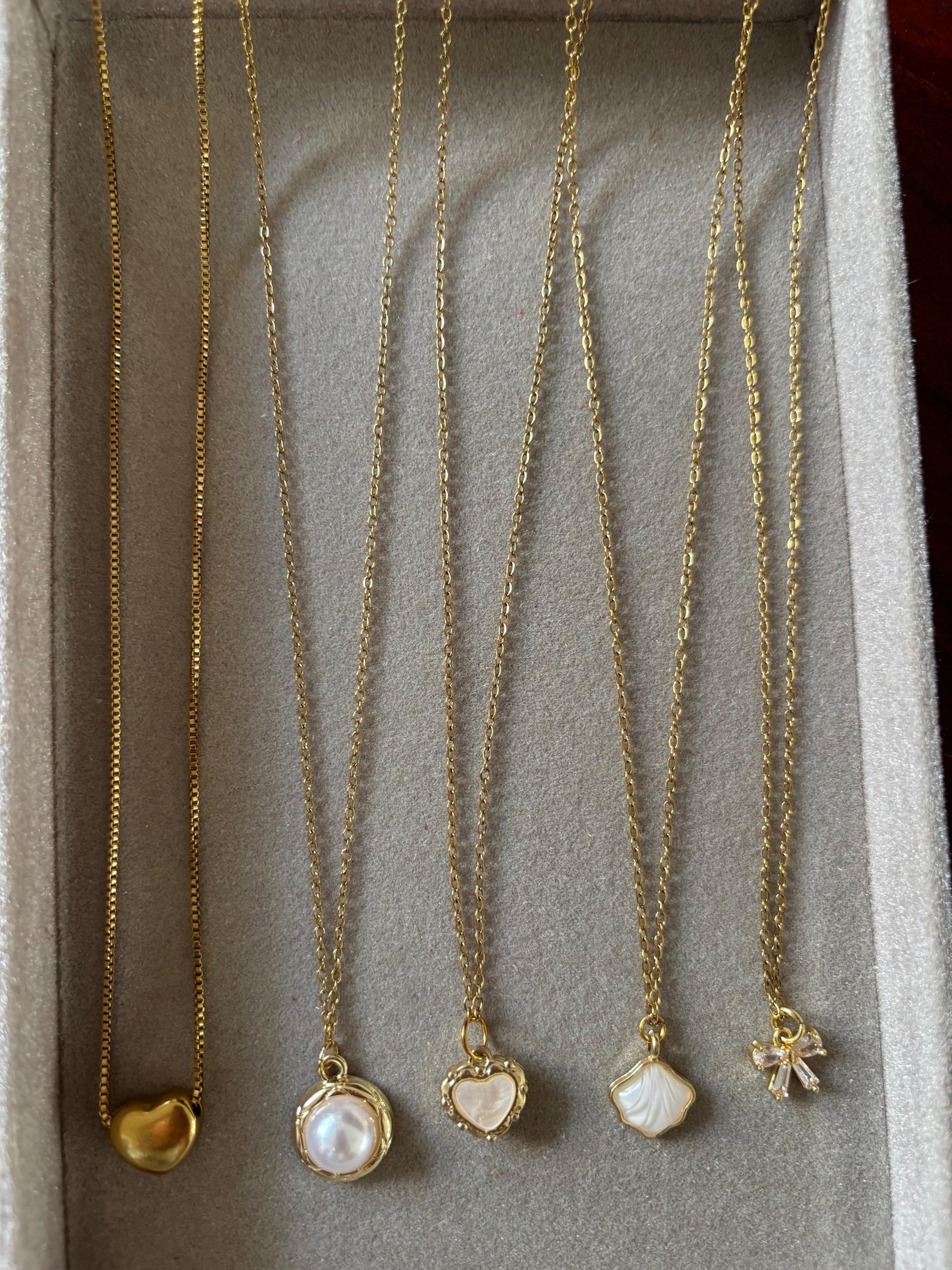 a gold chain with a black band