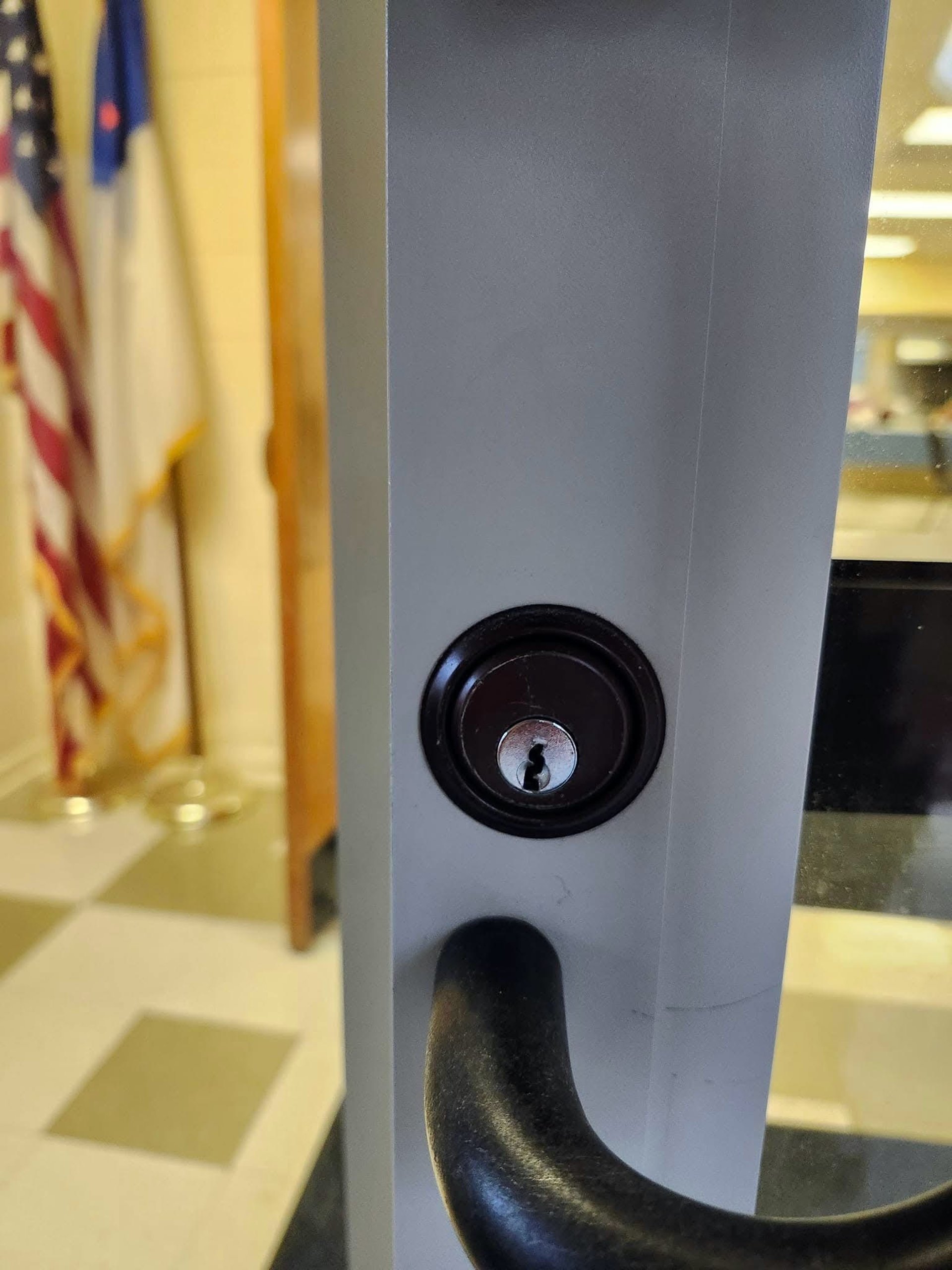 Close up of a commercial door lock and handle on a business entrance 