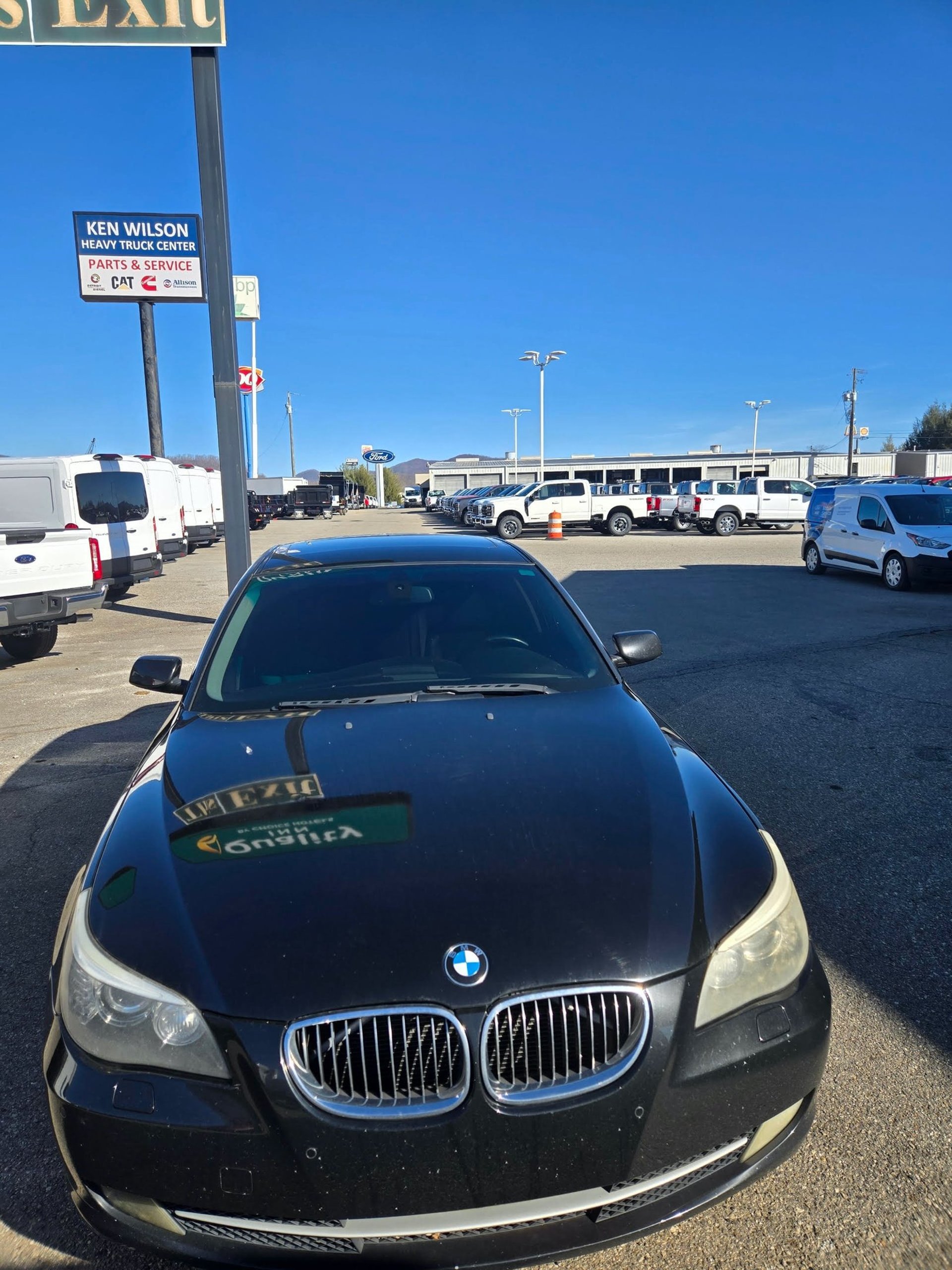 Black BMW parked on a dealership lot