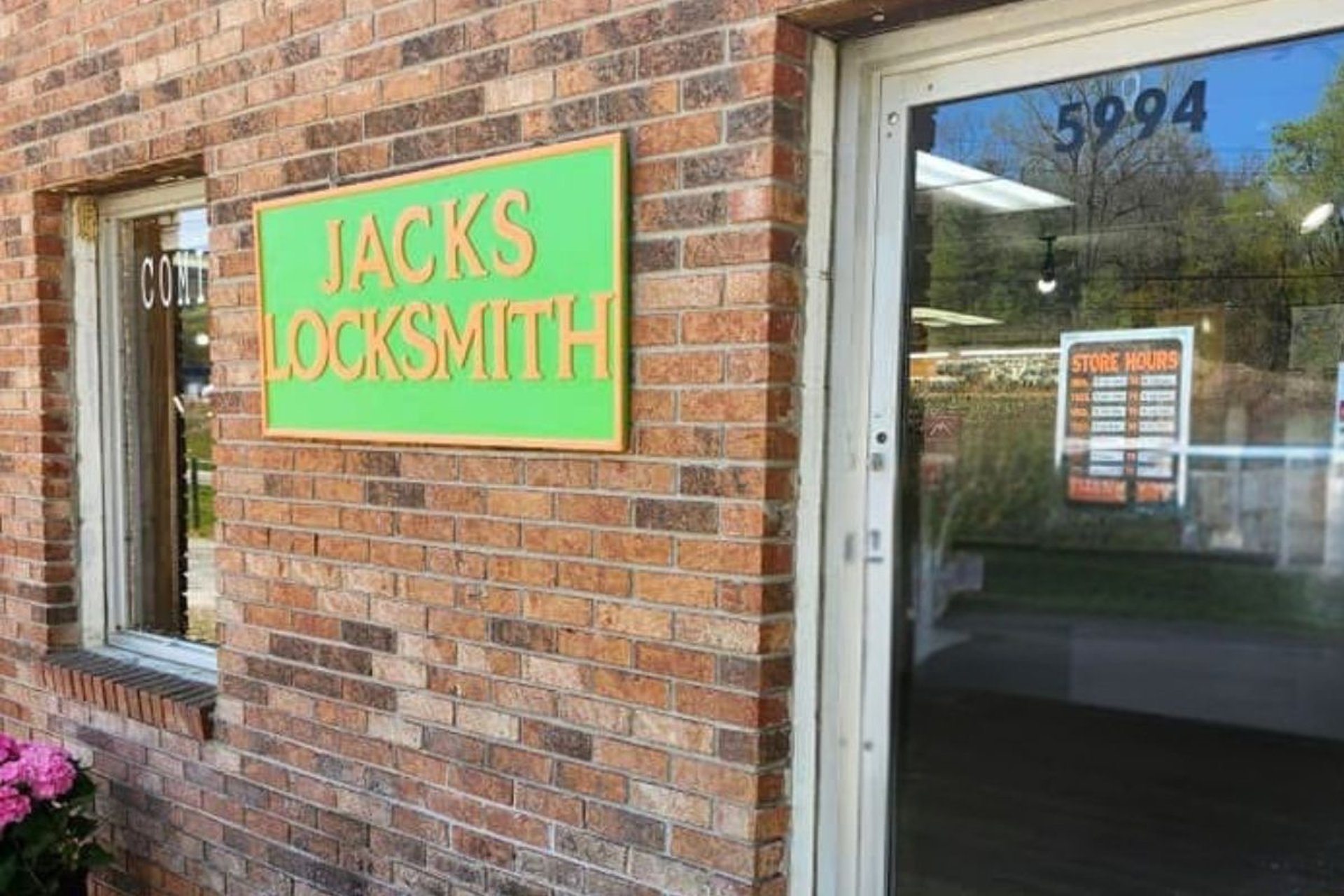 Jack's Locksmith storefront sign on a brick building in Burnsville, North Carolina
