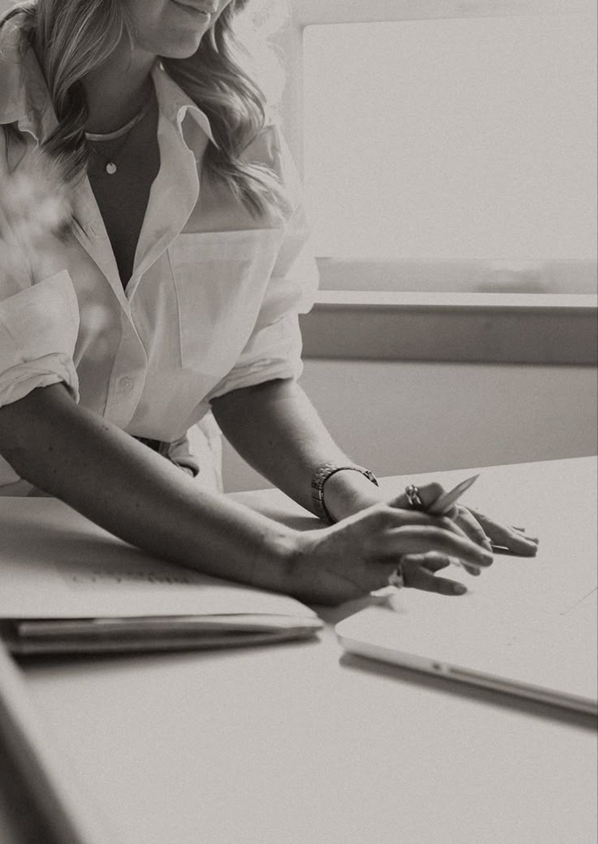 an abstract photo of a curved building with a blue sky in the background