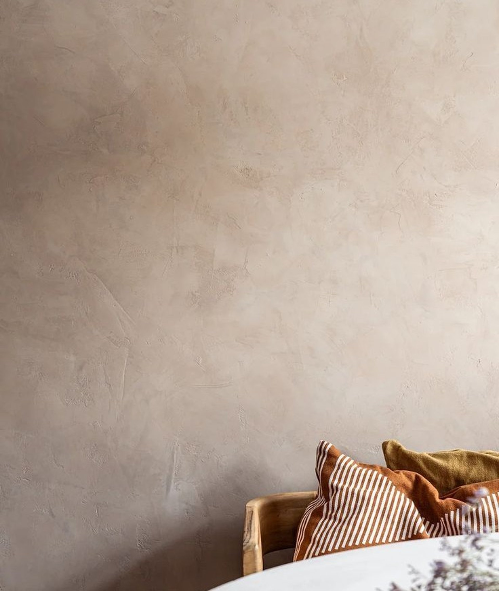 an abstract photo of a curved building with a blue sky in the background