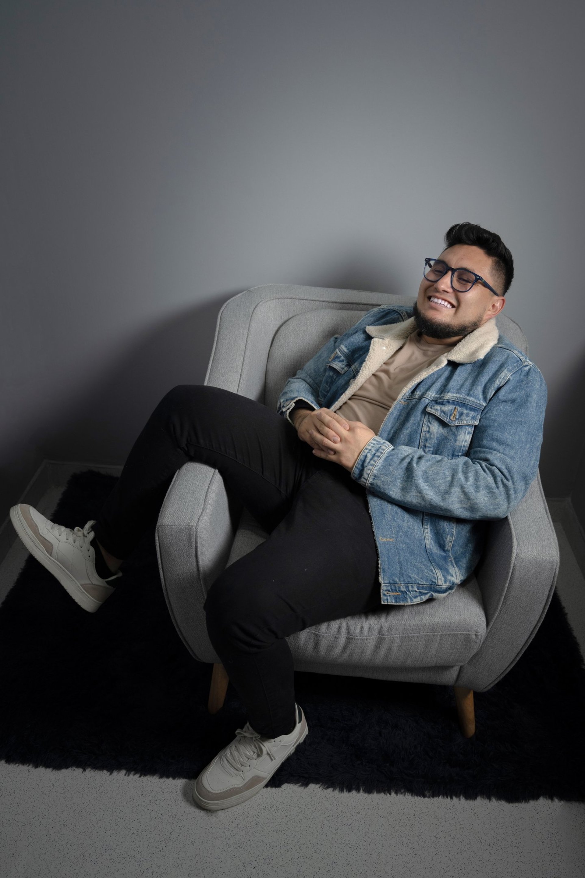 an abstract photo of a curved building with a blue sky in the background