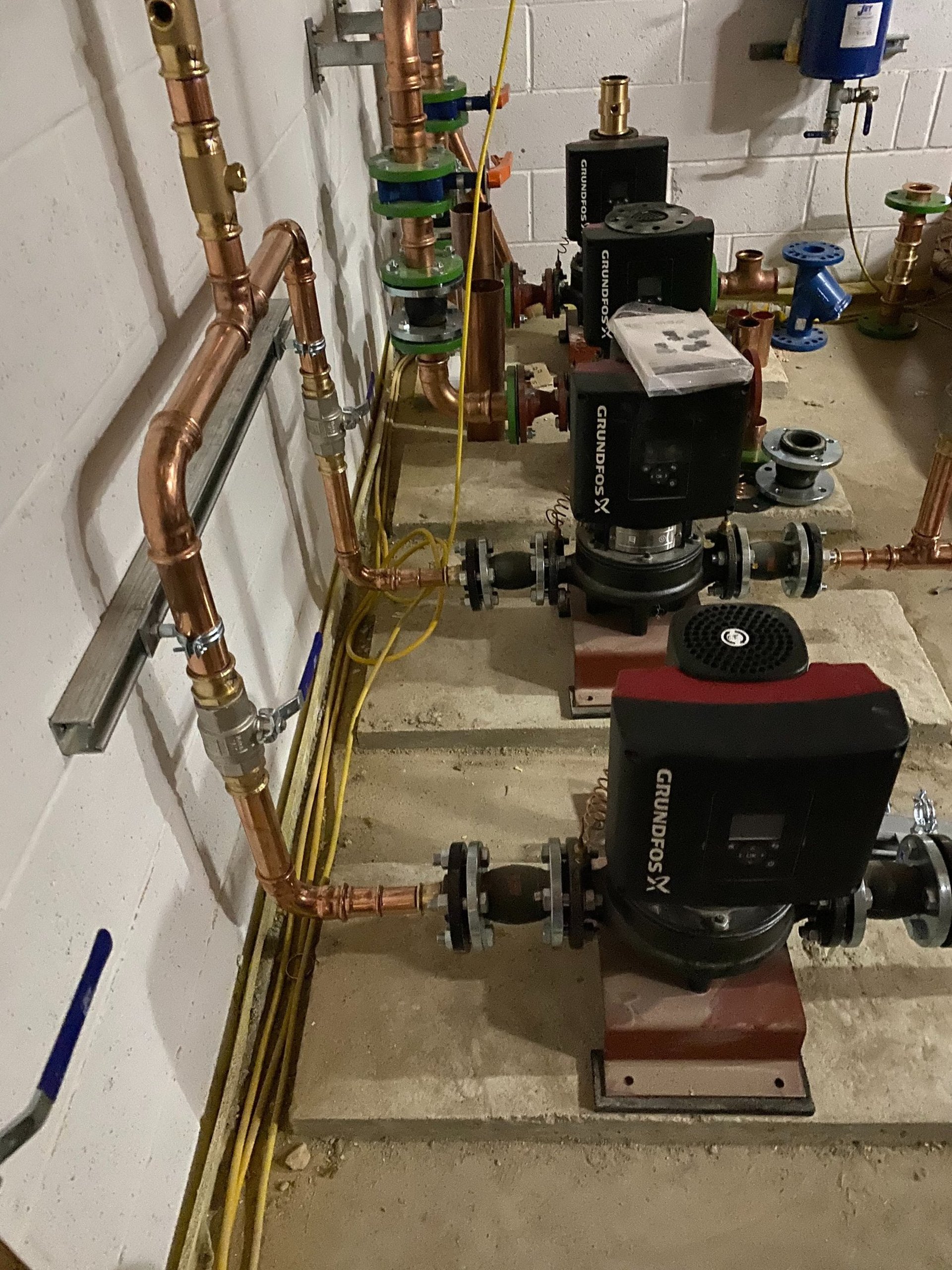 an abstract photo of a curved building with a blue sky in the background