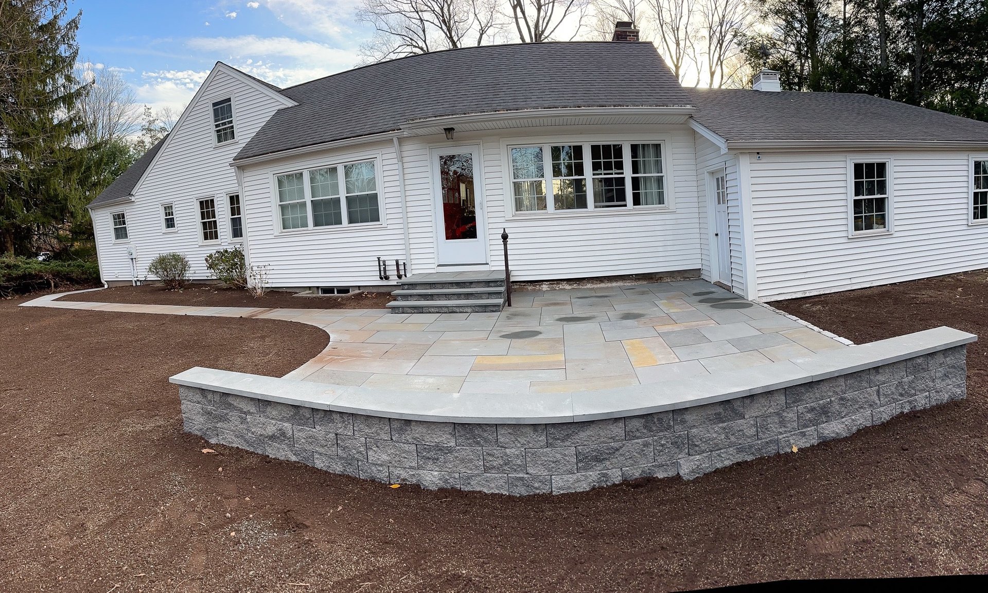 A man mowing a lawn with a lawn mower