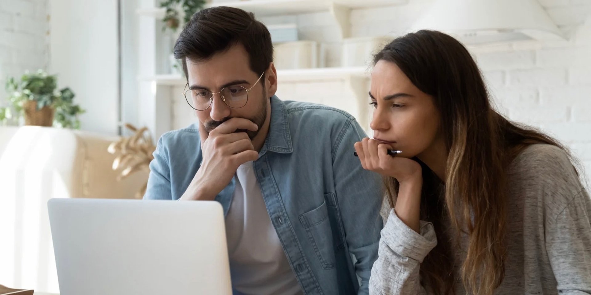 couple looking at building quote