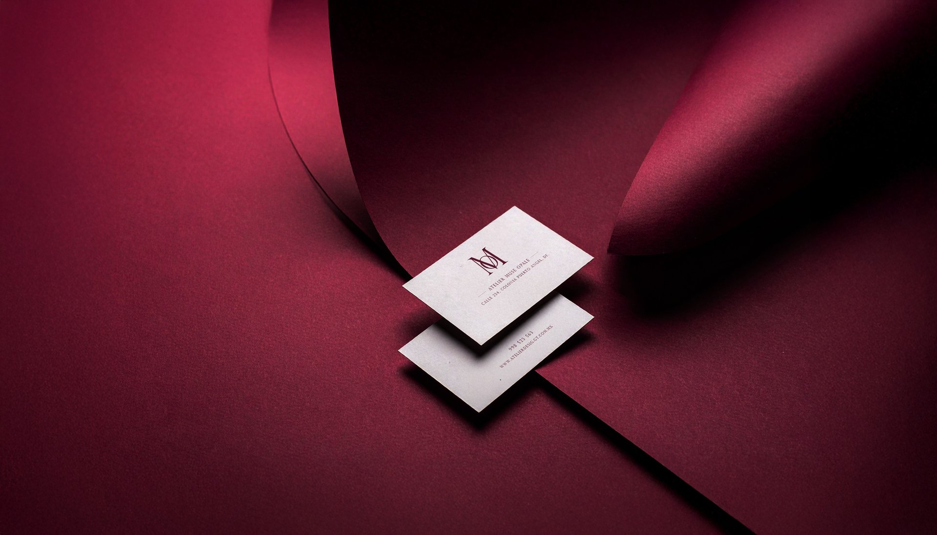 an abstract photo of a curved building with a blue sky in the background