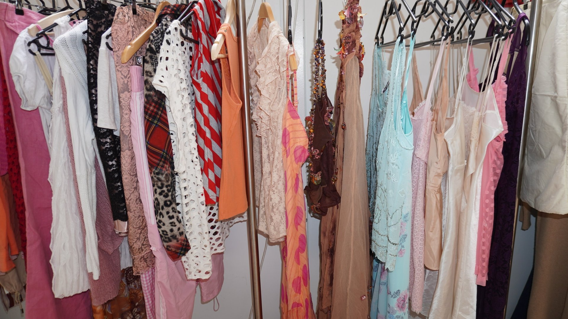 an abstract photo of a curved building with a blue sky in the background