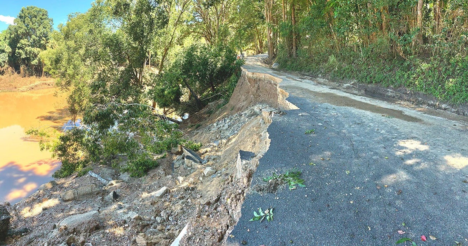an abstract photo of a curved building with a blue sky in the background