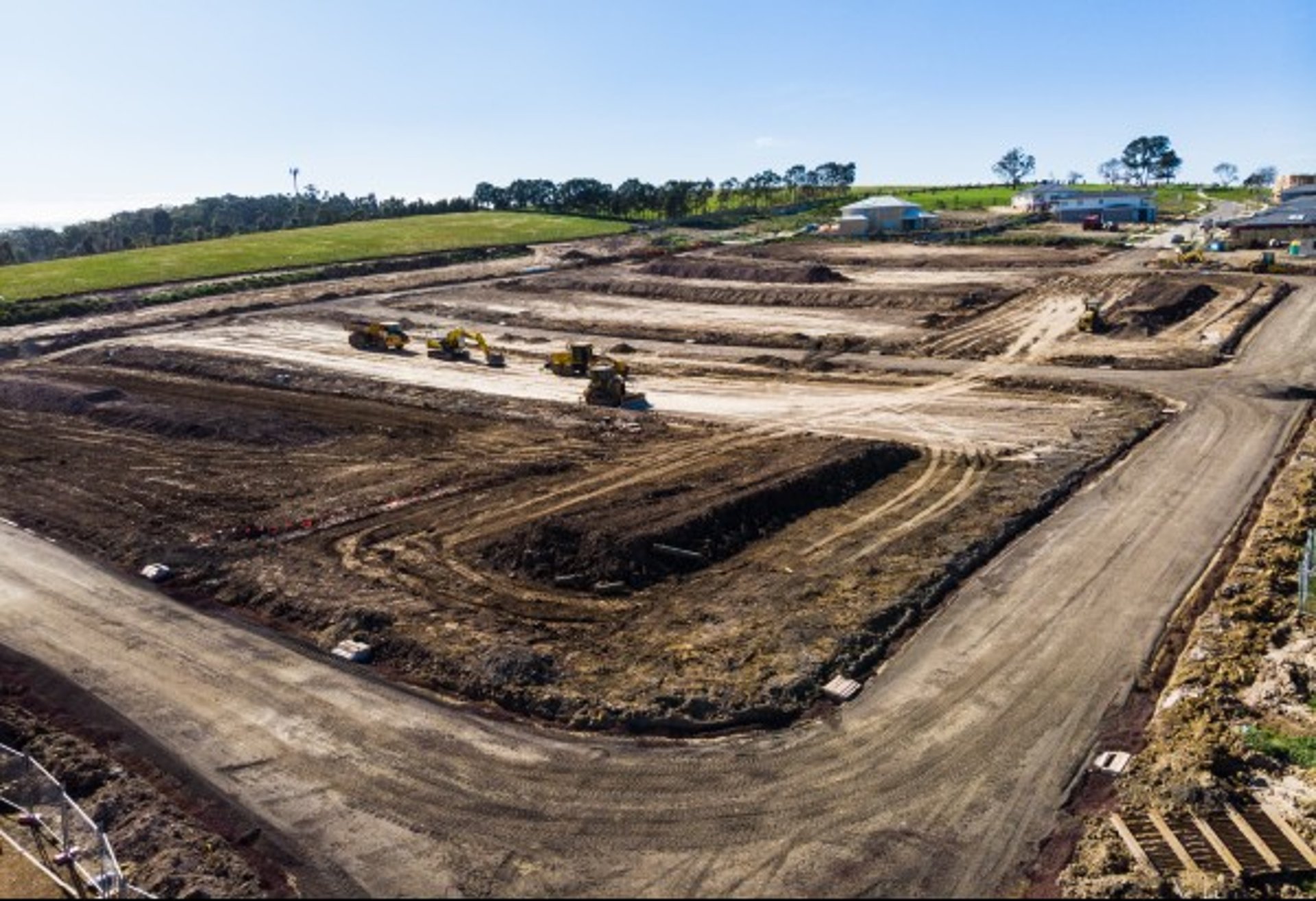an abstract photo of a curved building with a blue sky in the background
