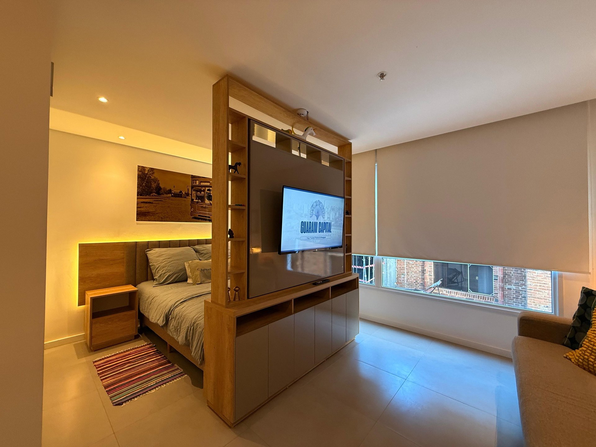 a living room filled with furniture and a large window