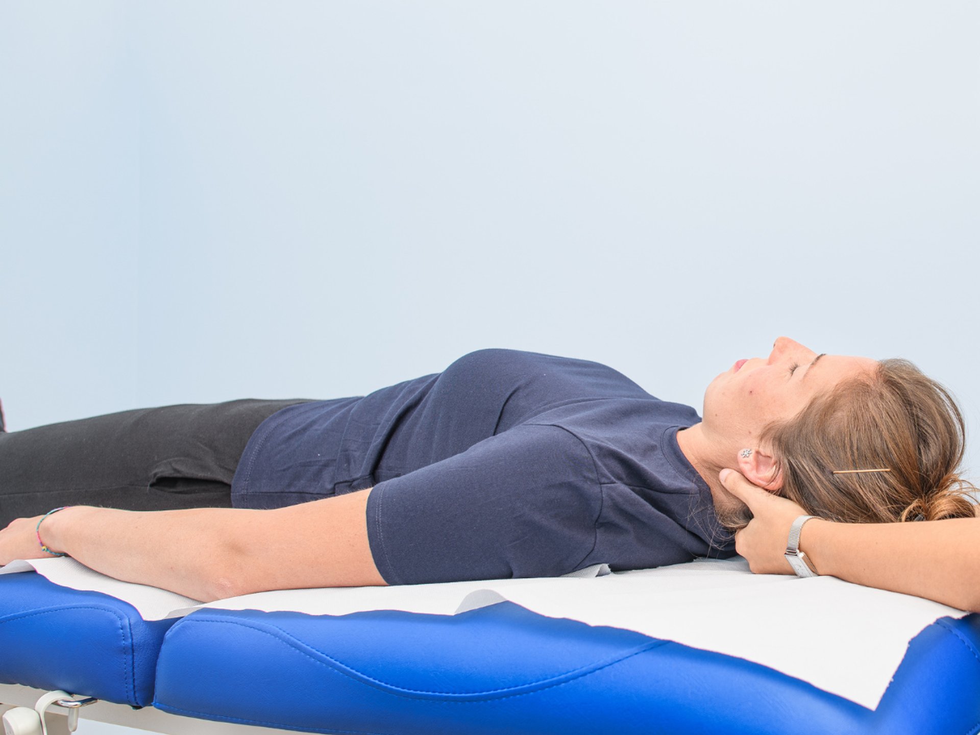 a woman getting a back massage from a man