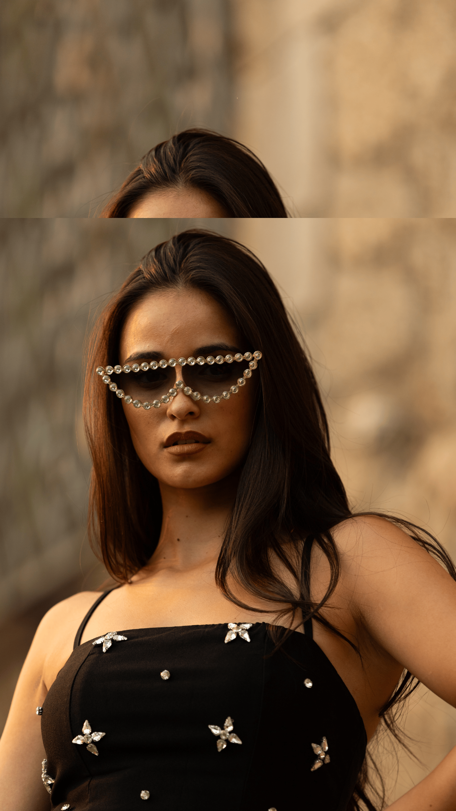 woman holding round sunglasses during daytime