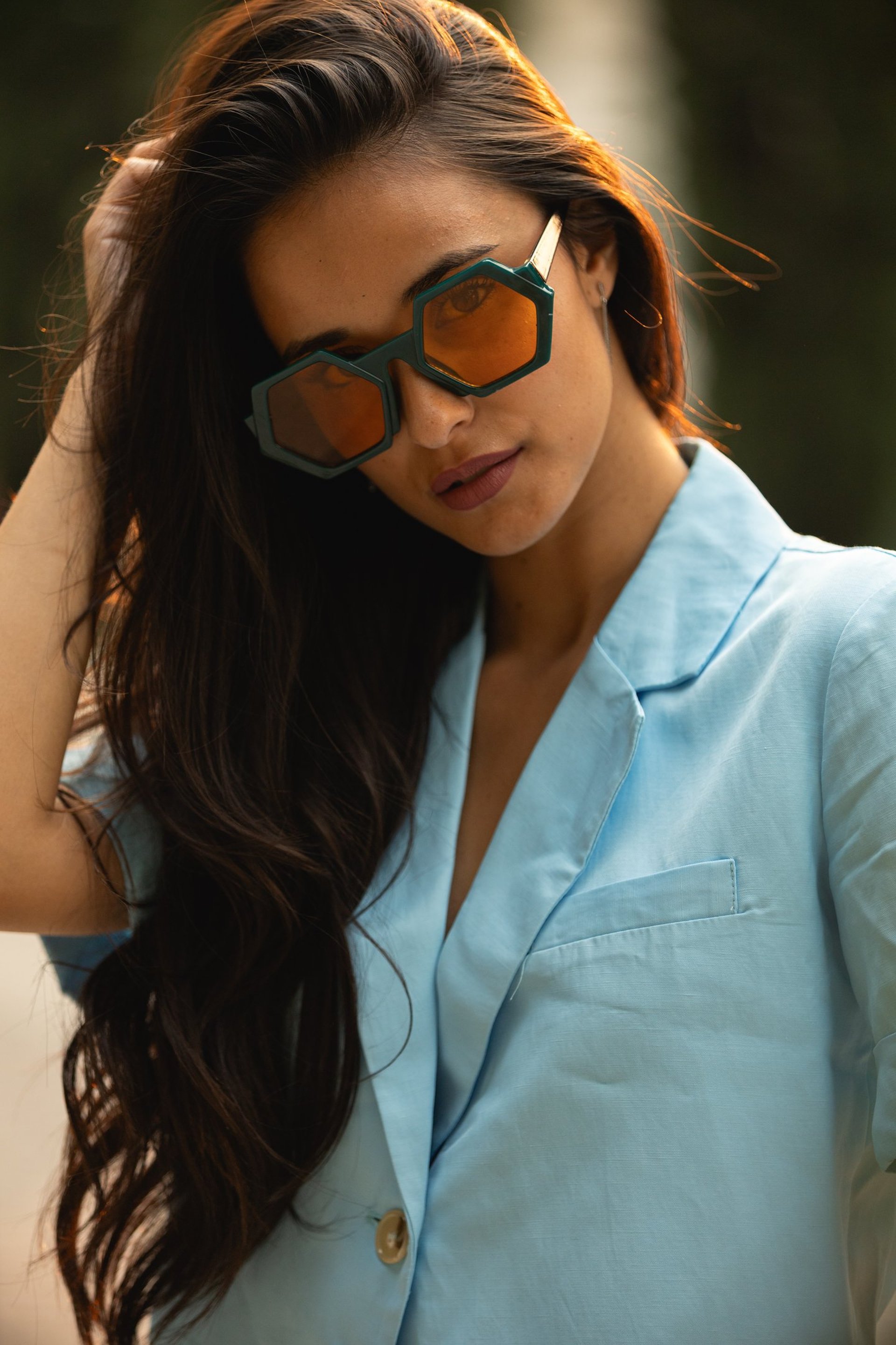woman in black shirt wearing eyeglasses smiling