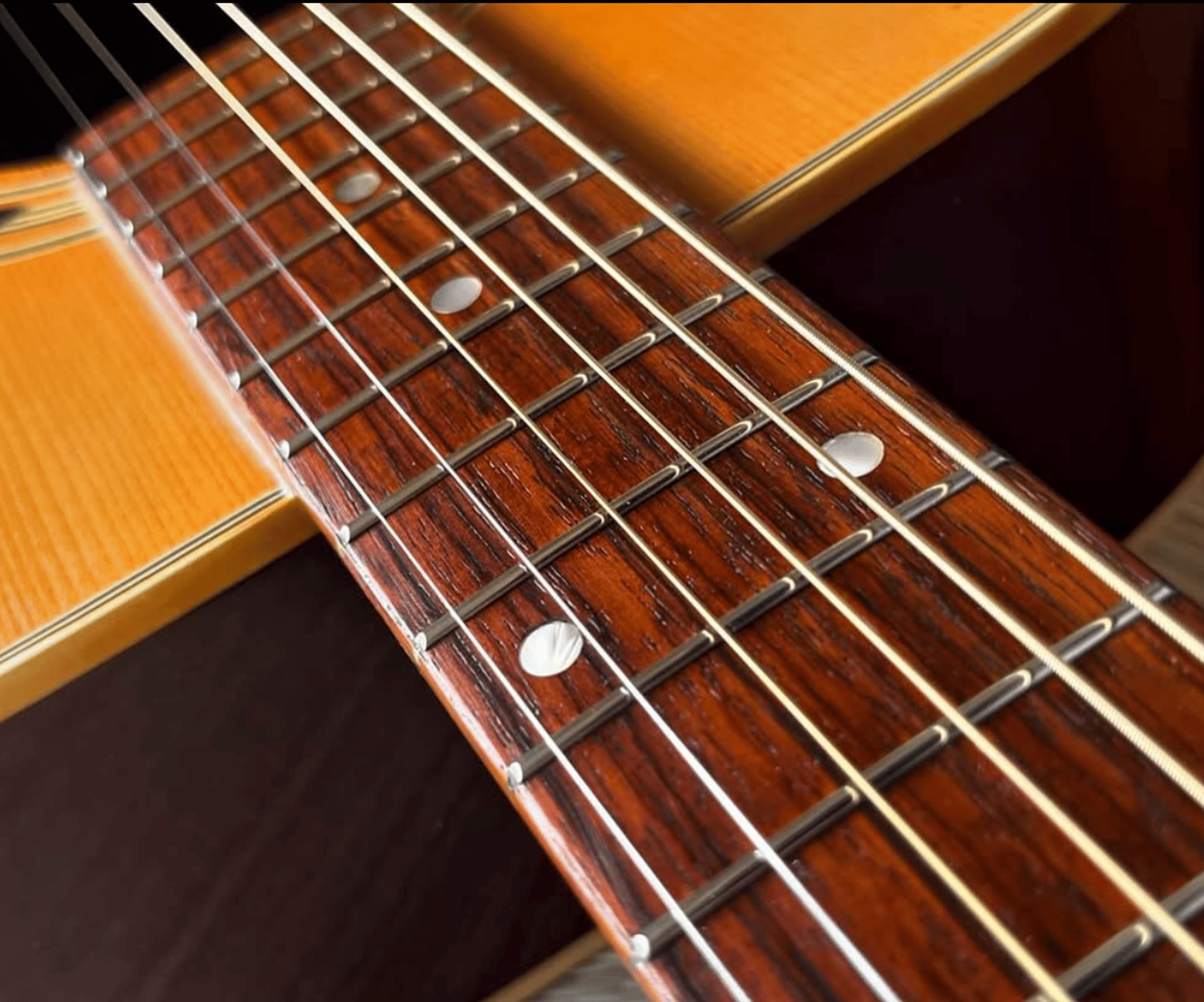 an abstract photo of a curved building with a blue sky in the background