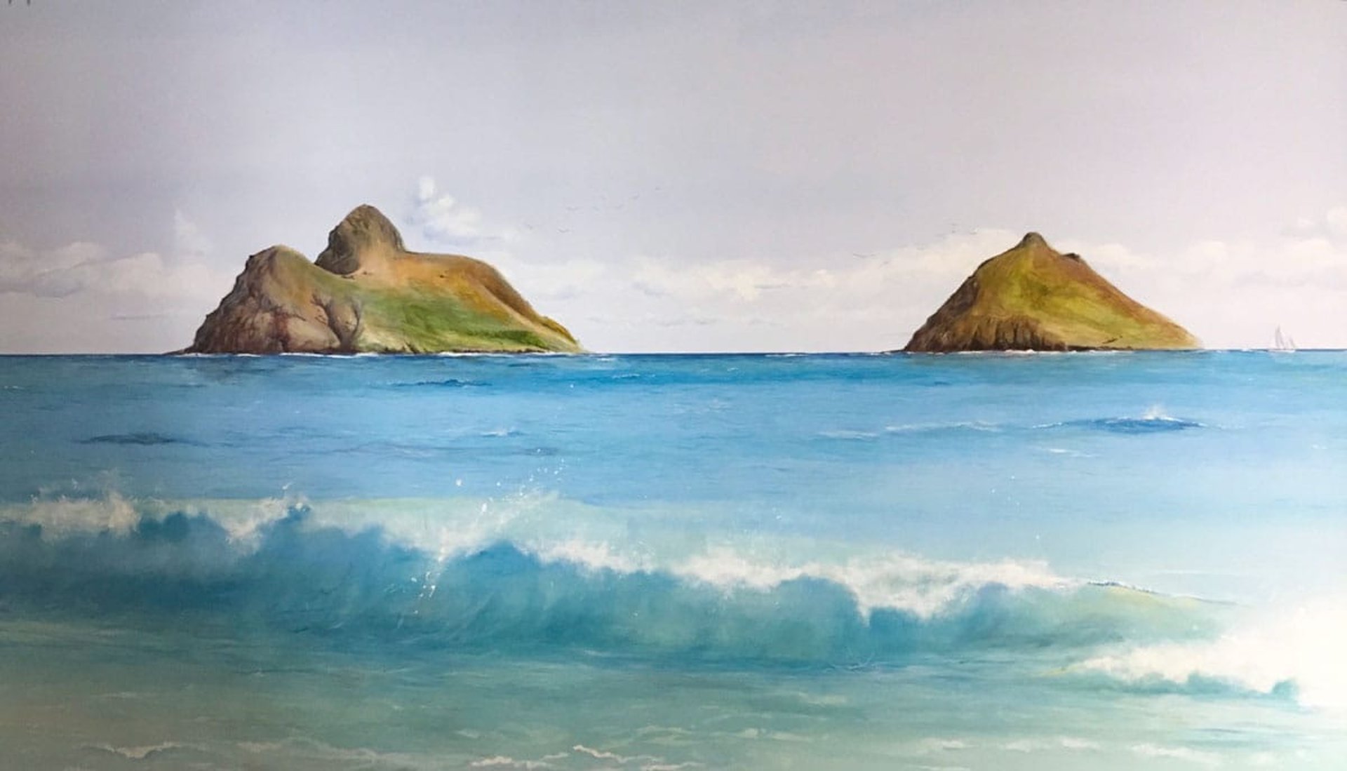 Hand-painted mural of two Hawaiian islands, turquoise ocean, a sailboat and a breaking wave.