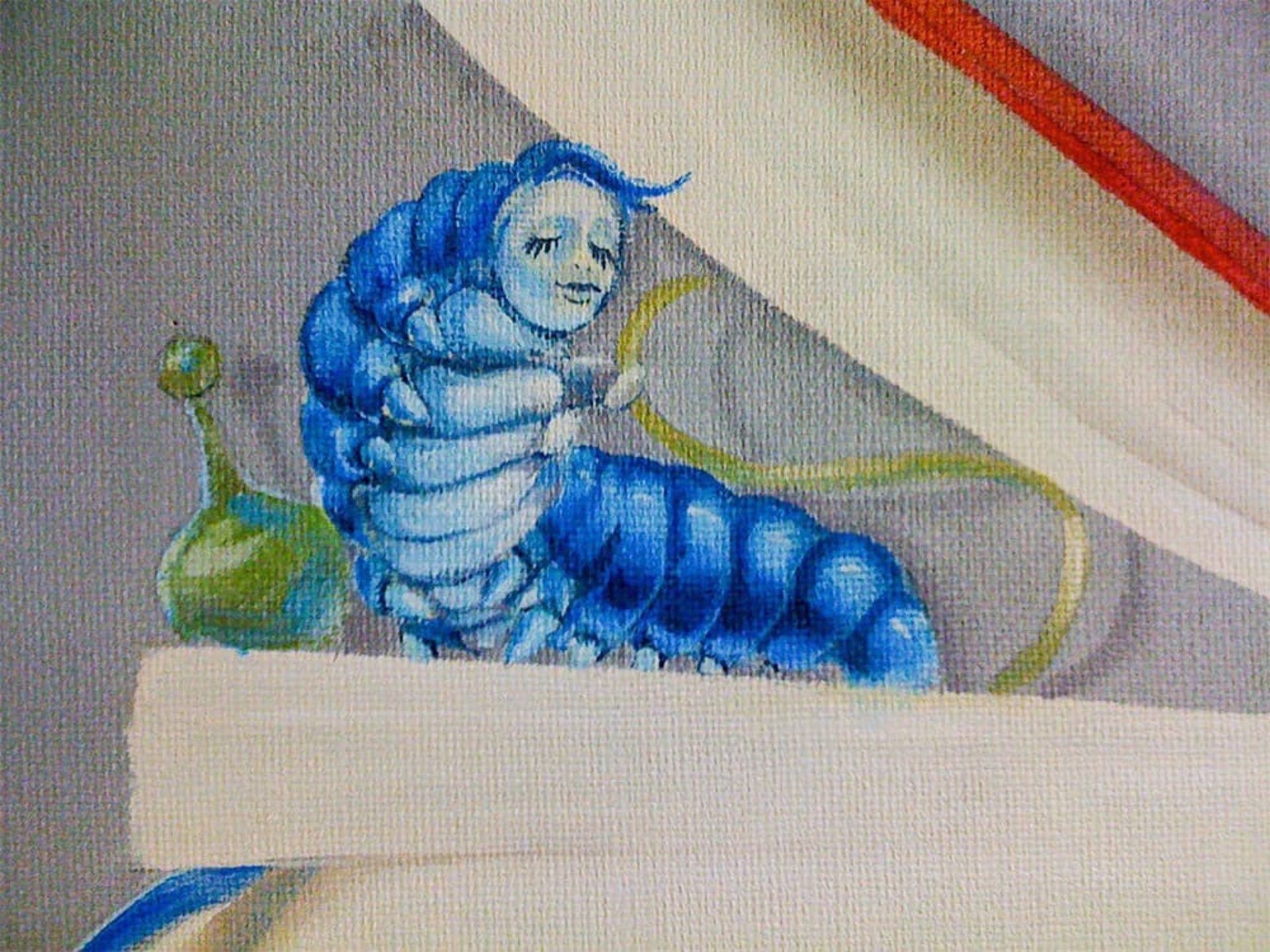 Close-up of an opened book with the caterpillar from Alice in Wonderland
