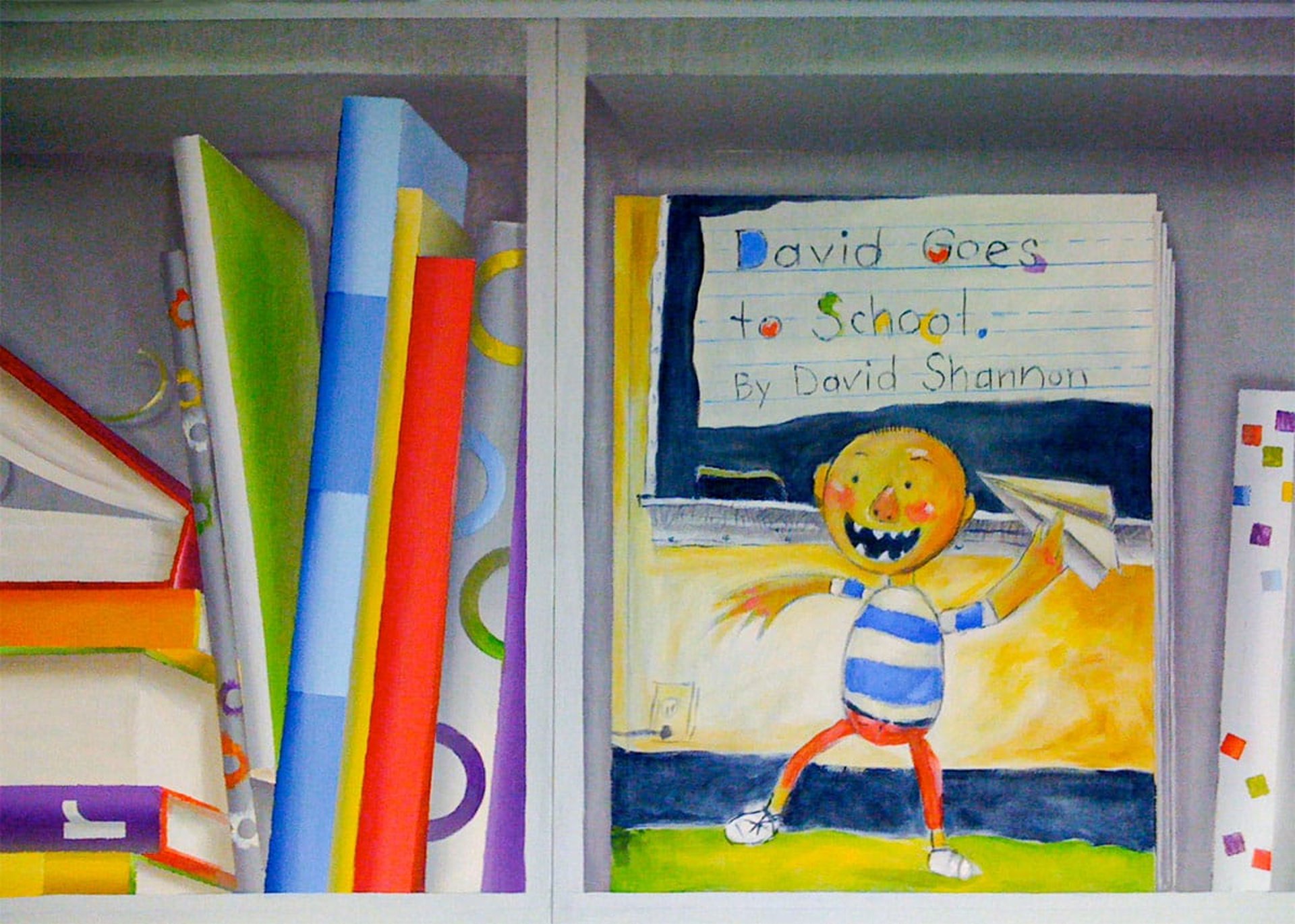 A trompe l'oeil mural with a close-up of a book cover from David Goes to School series