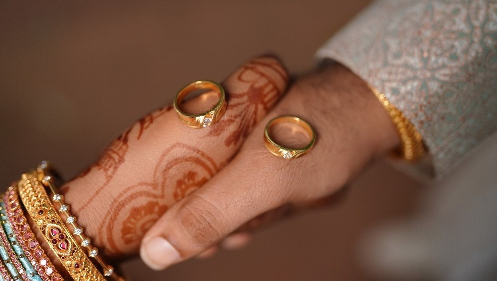 selective focus of two person holding hands