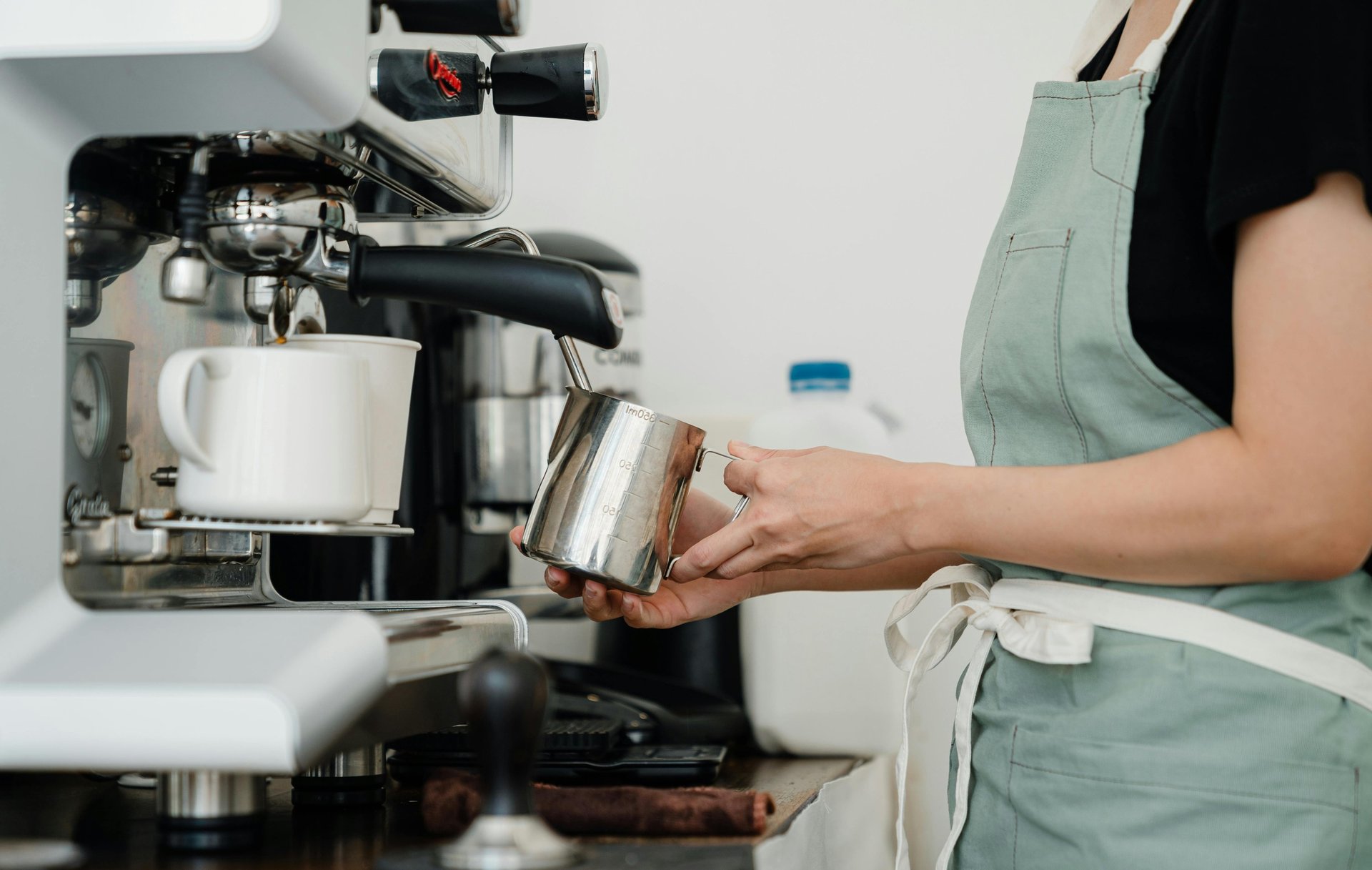 selective focus photography of black espresso machine