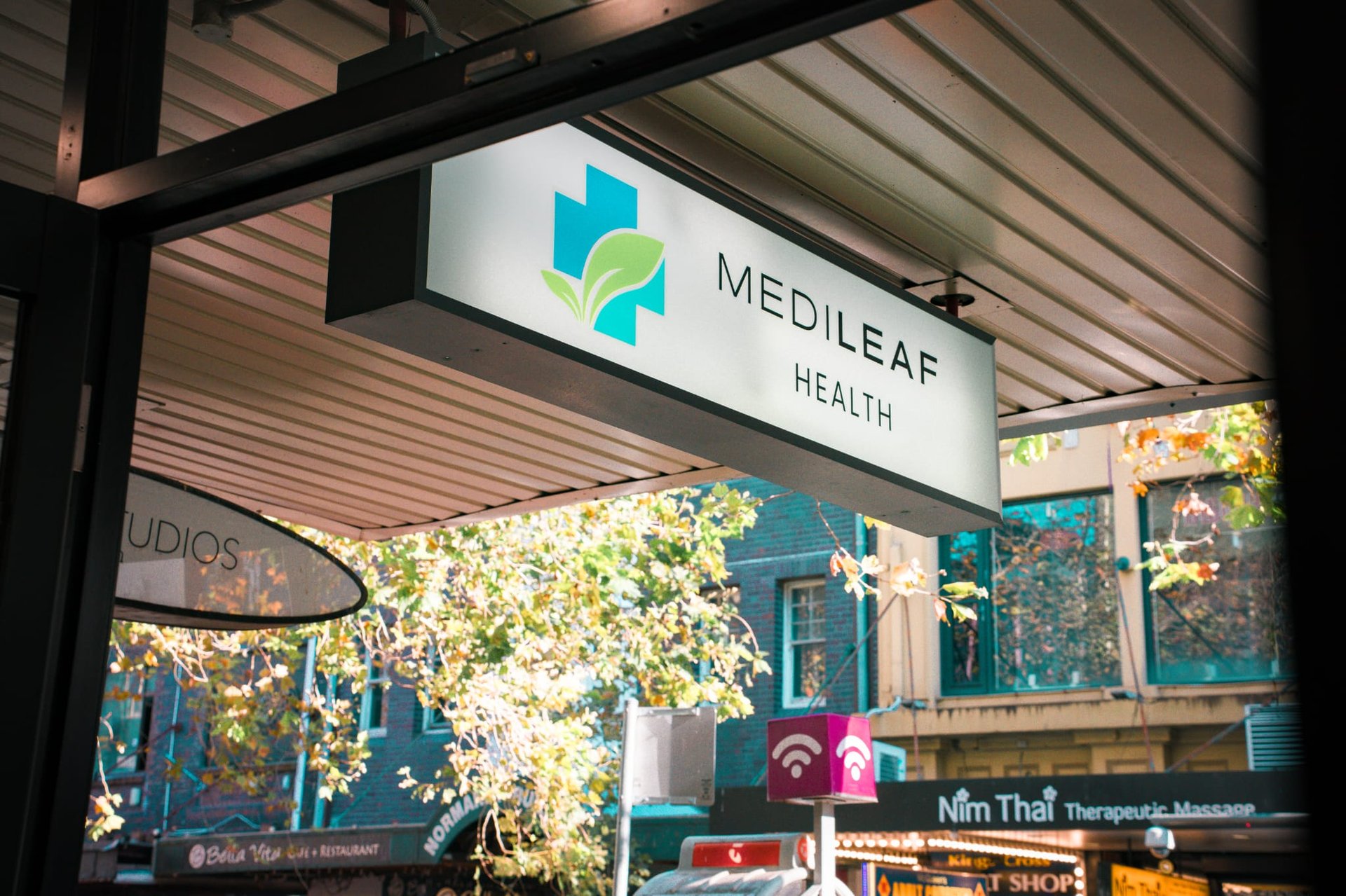 woman in white and brown dress standing on green grass during night time