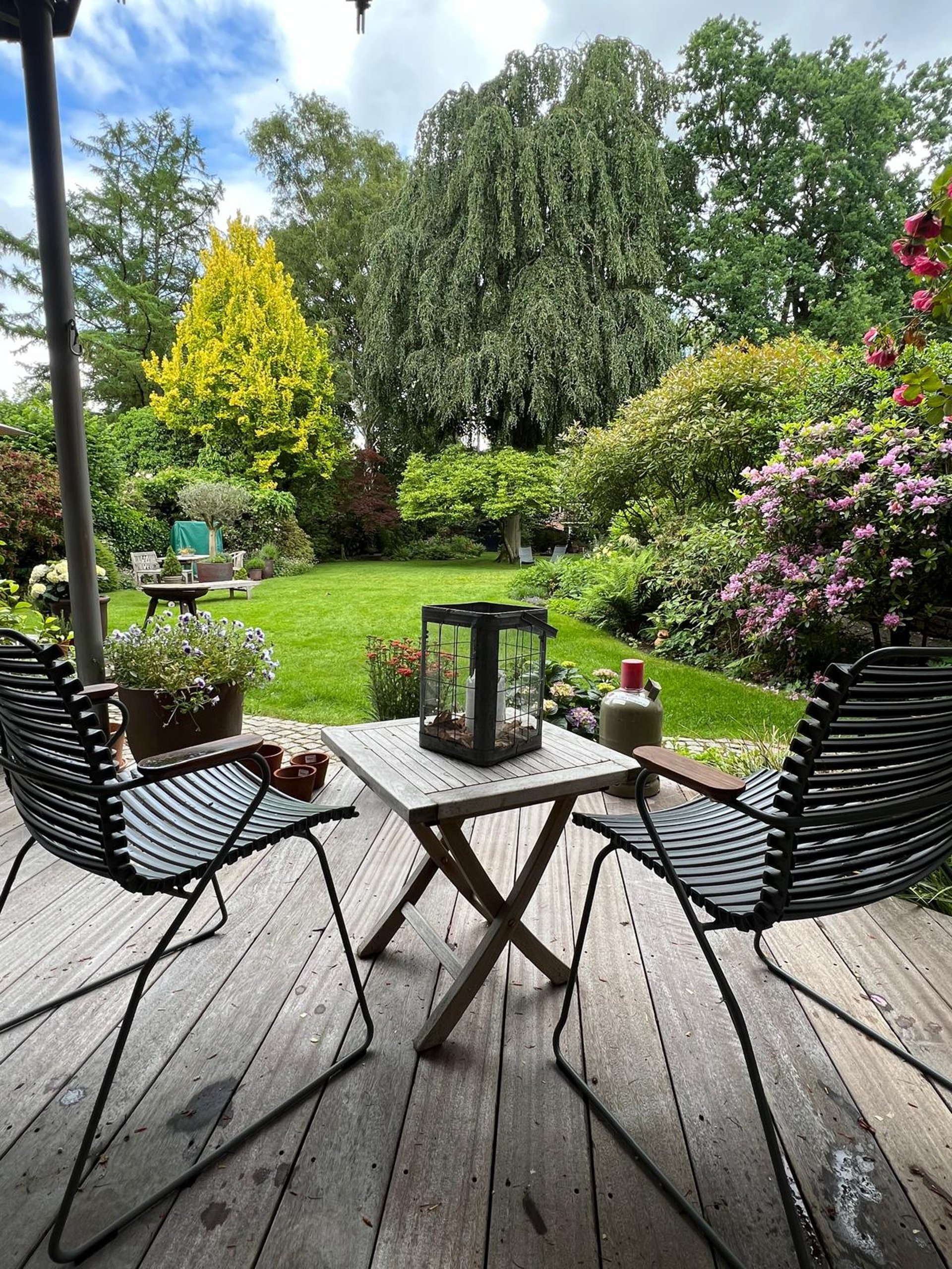 oval brown wooden conference table and chairs inside conference room