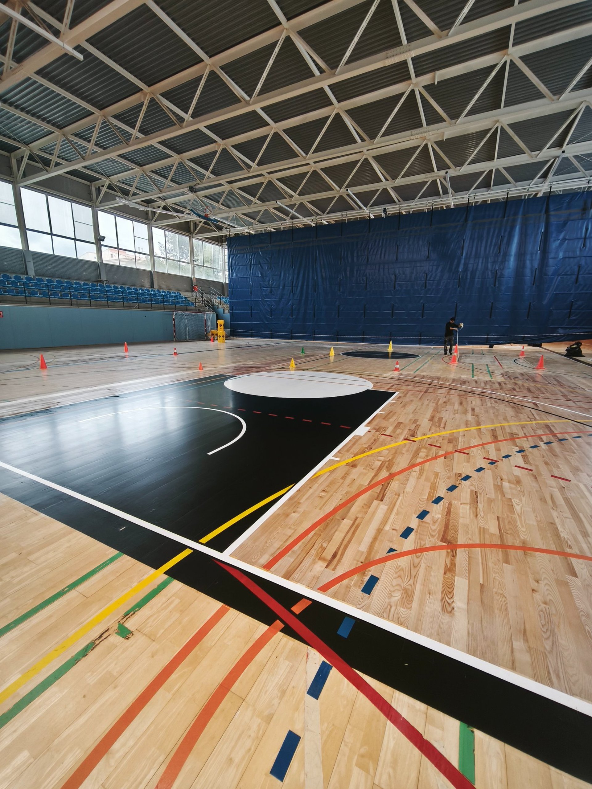an abstract photo of a curved building with a blue sky in the background