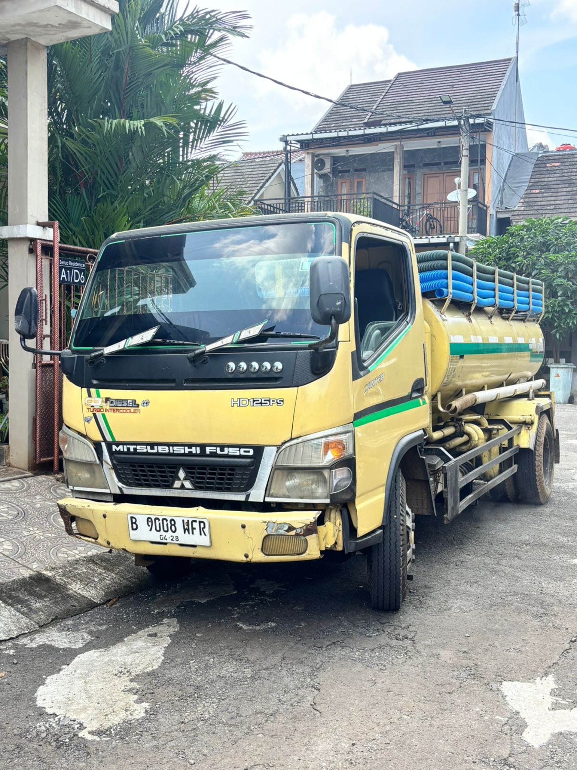 an abstract photo of a curved building with a blue sky in the background