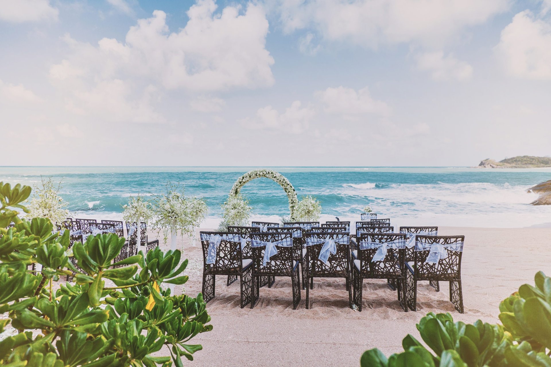 Heart-shaped floral arch on a beach
