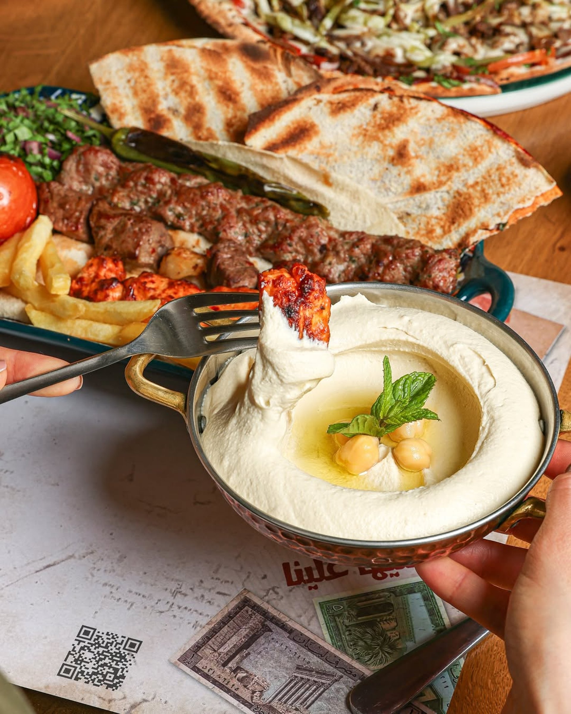 woman wearing yellow long-sleeved dress under white clouds and blue sky during daytime