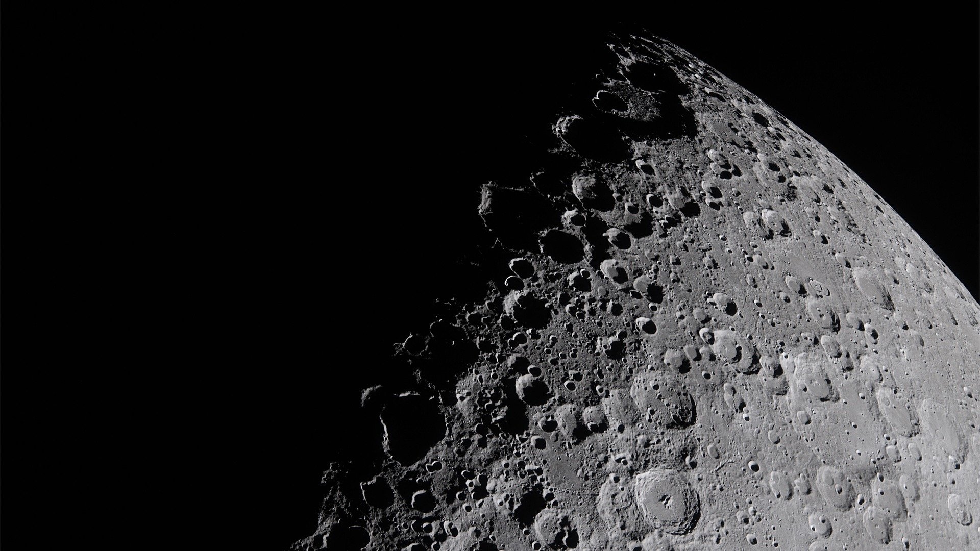a close up of the moon in the dark sky