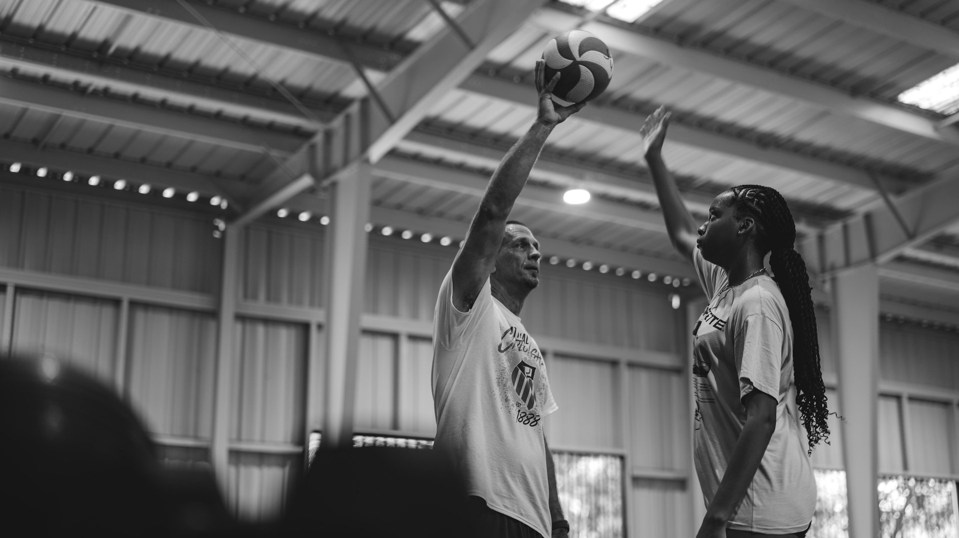 yellow and white volleyball on brown sand during daytime