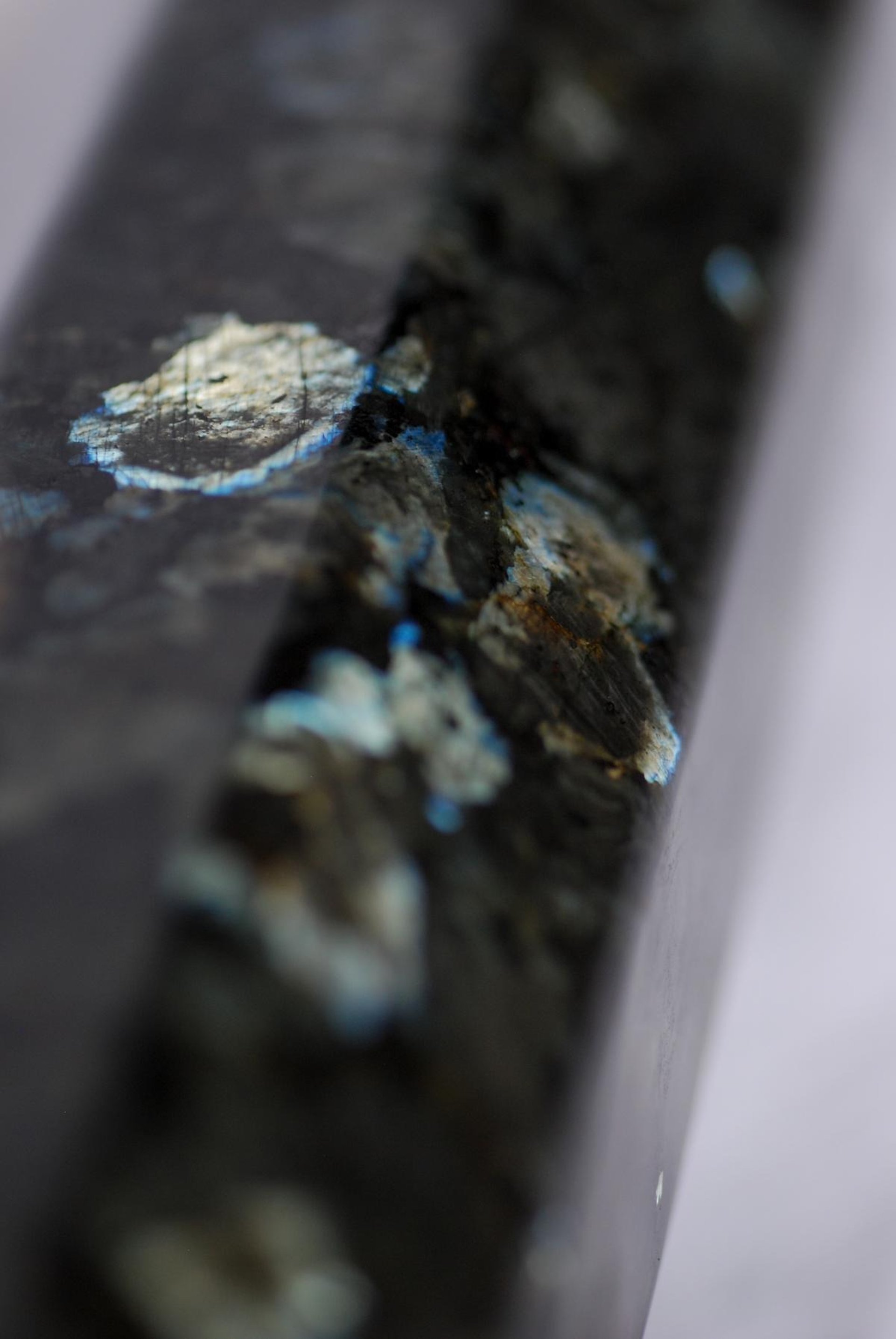 an abstract photo of a curved building with a blue sky in the background