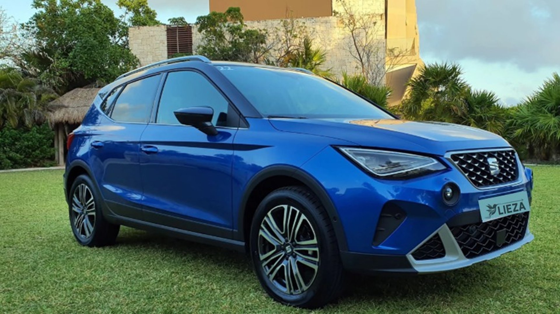 woman wearing yellow long-sleeved dress under white clouds and blue sky during daytime