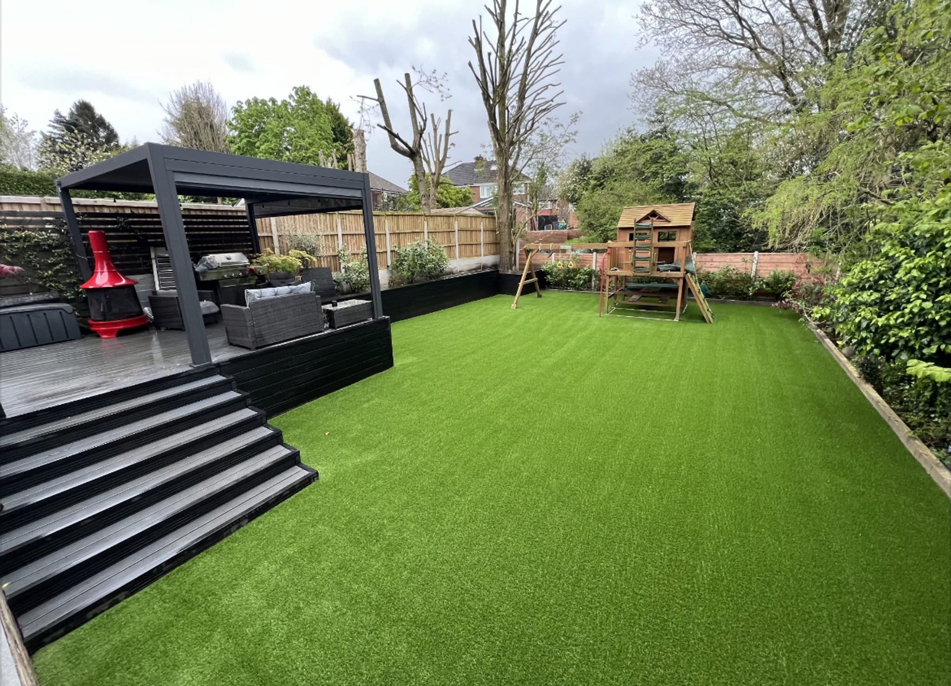 a house with a lawn and steps leading to it