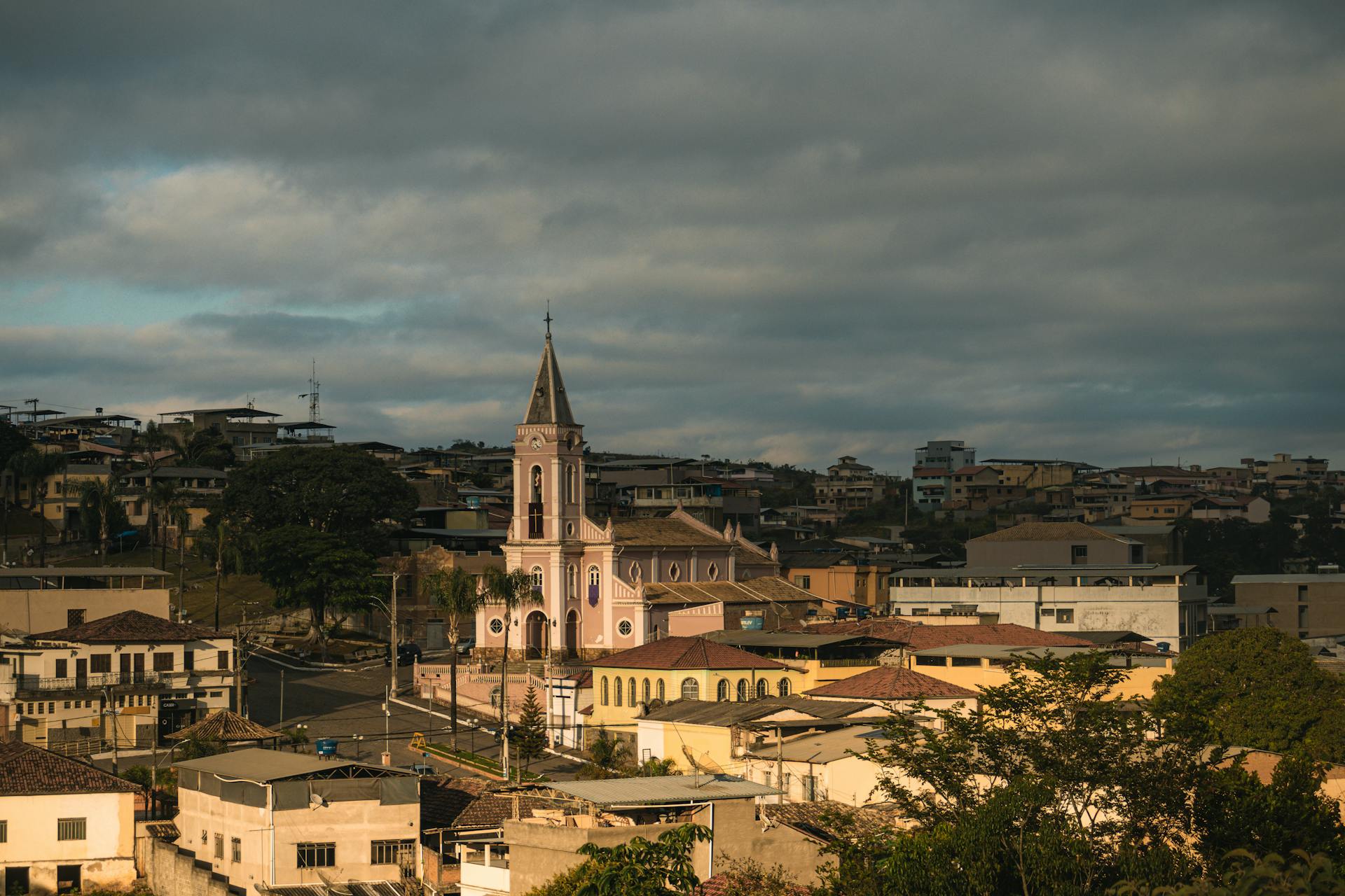 woman wearing yellow long-sleeved dress under white clouds and blue sky during daytime