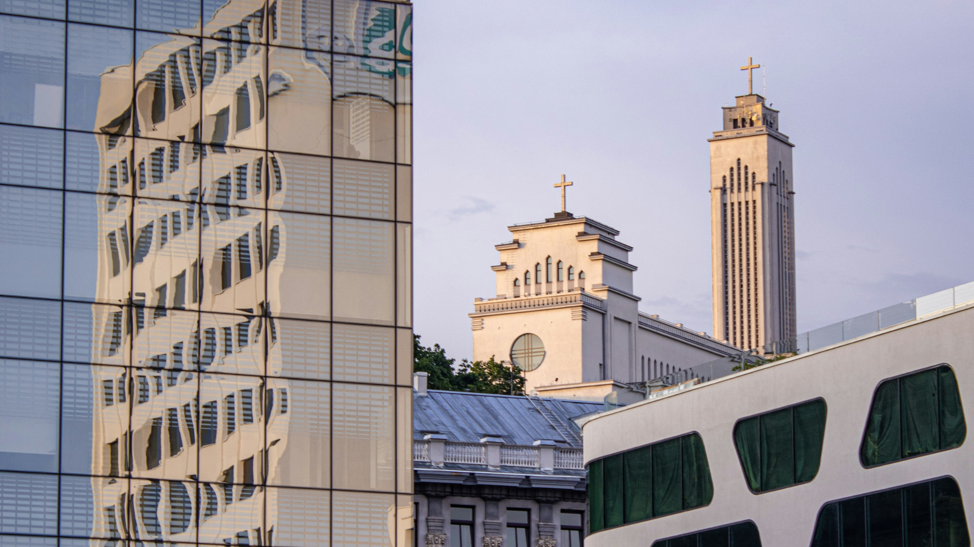 a street with cars and people walking on it