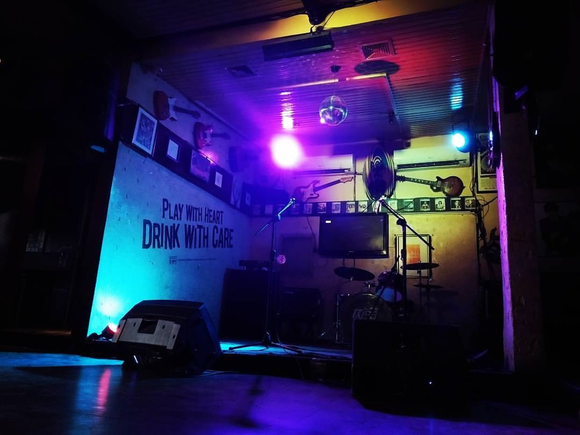 an abstract photo of a curved building with a blue sky in the background