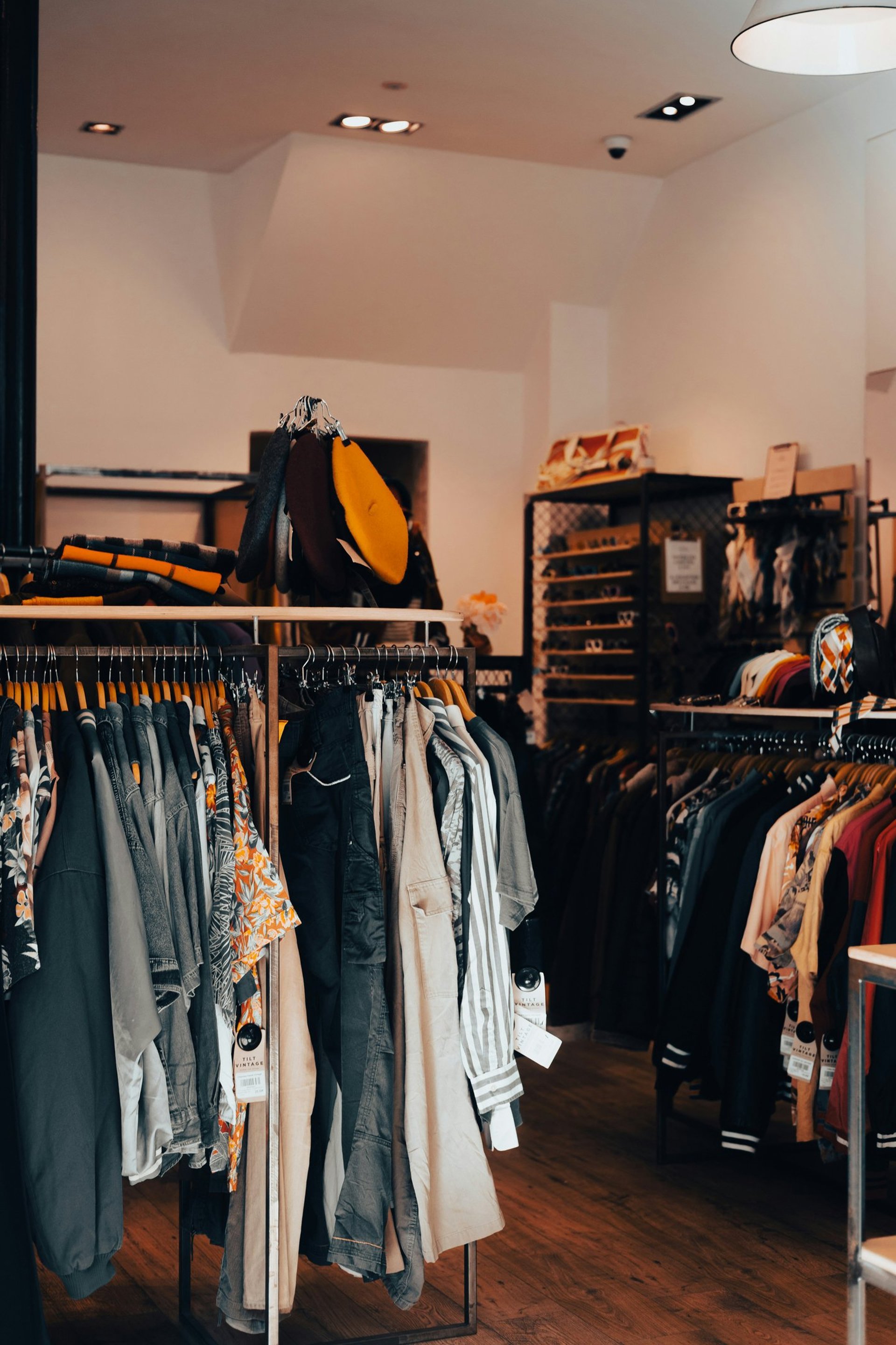 assorted clothes in wooden hangers