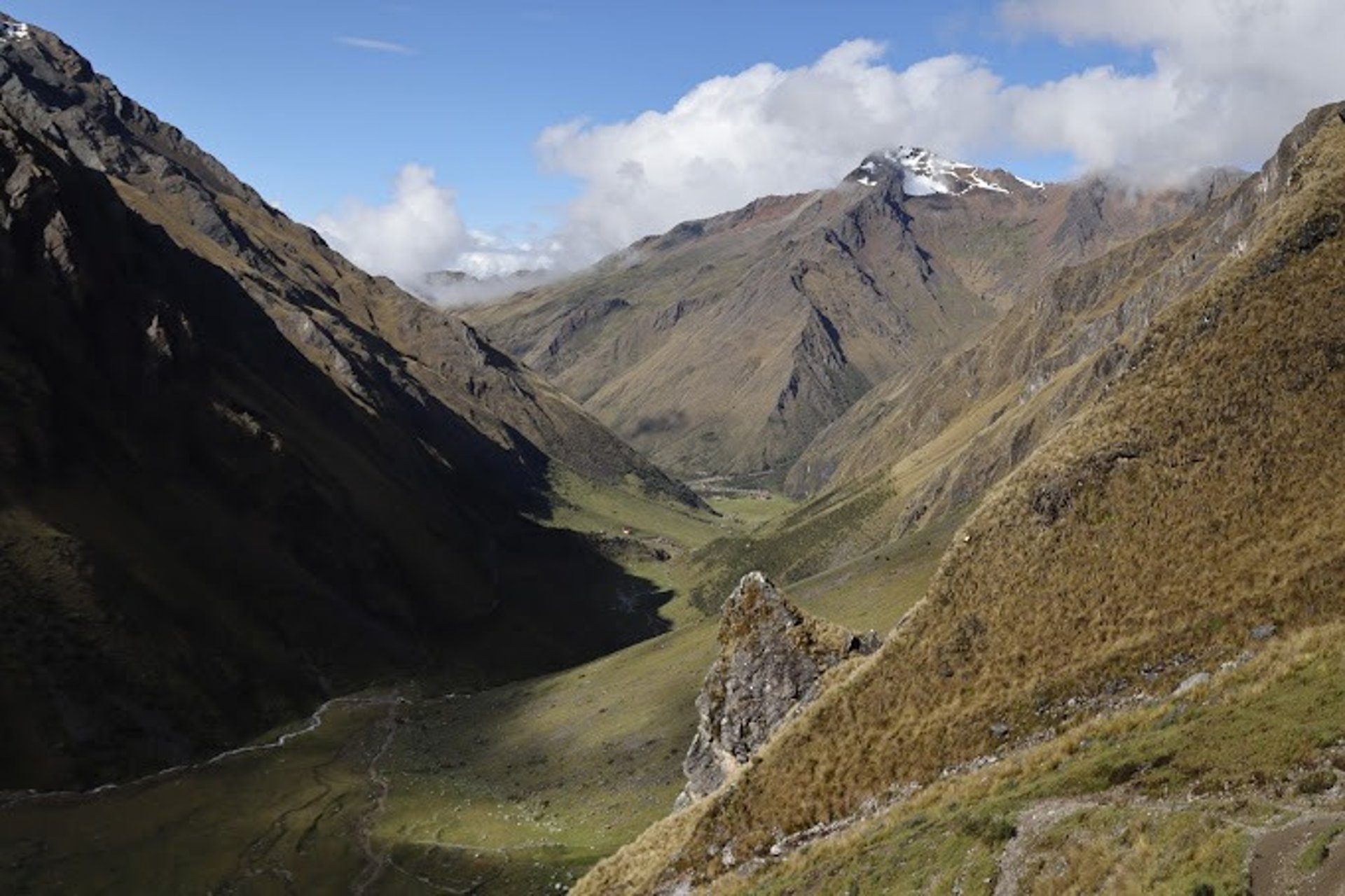 white mountain near body of water