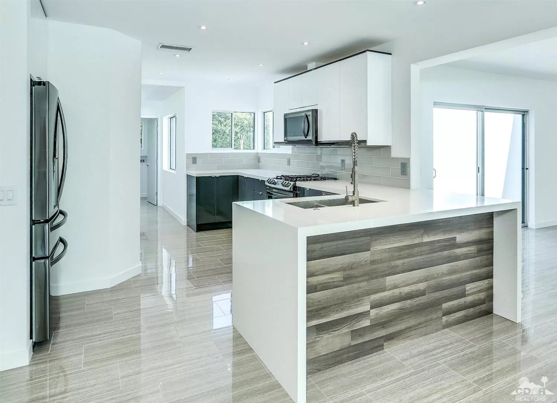 gray steel 3-door refrigerator near modular kitchen