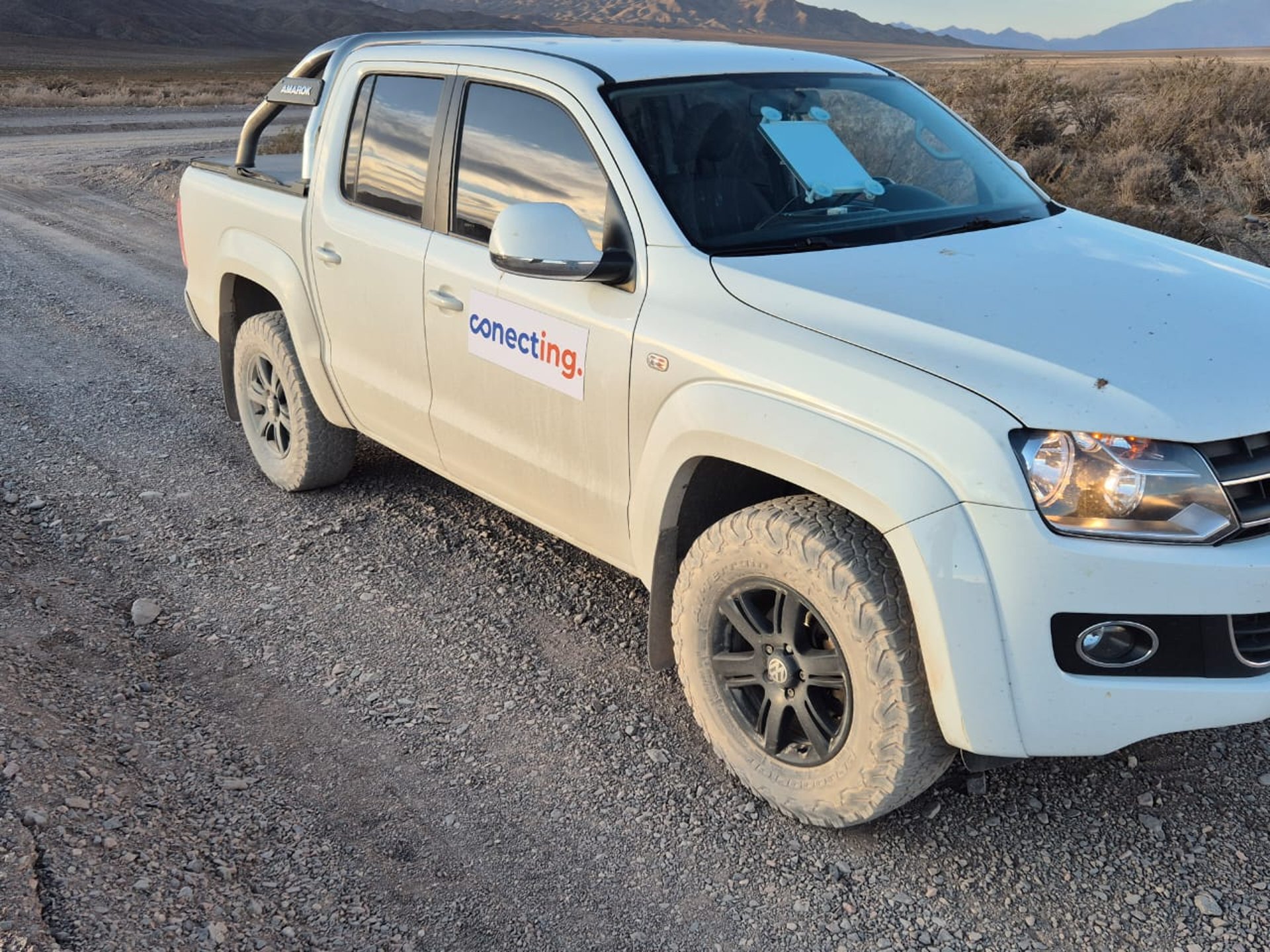 woman wearing yellow long-sleeved dress under white clouds and blue sky during daytime