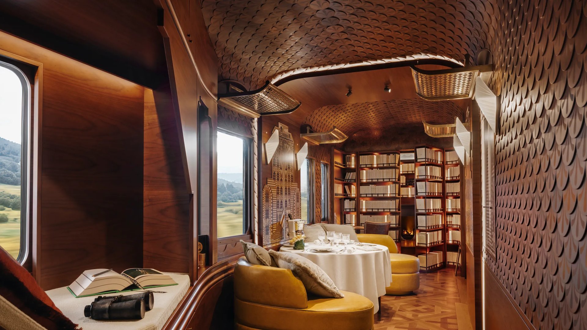 Britannic Explorer train L’Observatoire lounge with marquetry design and private dining area.