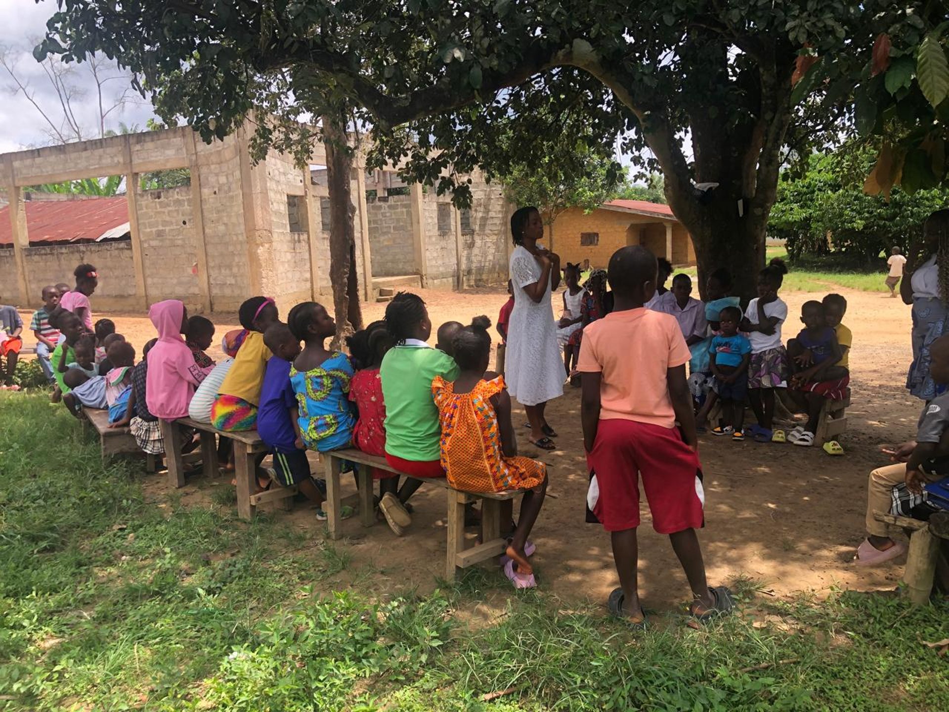 boy blowing green balloon
