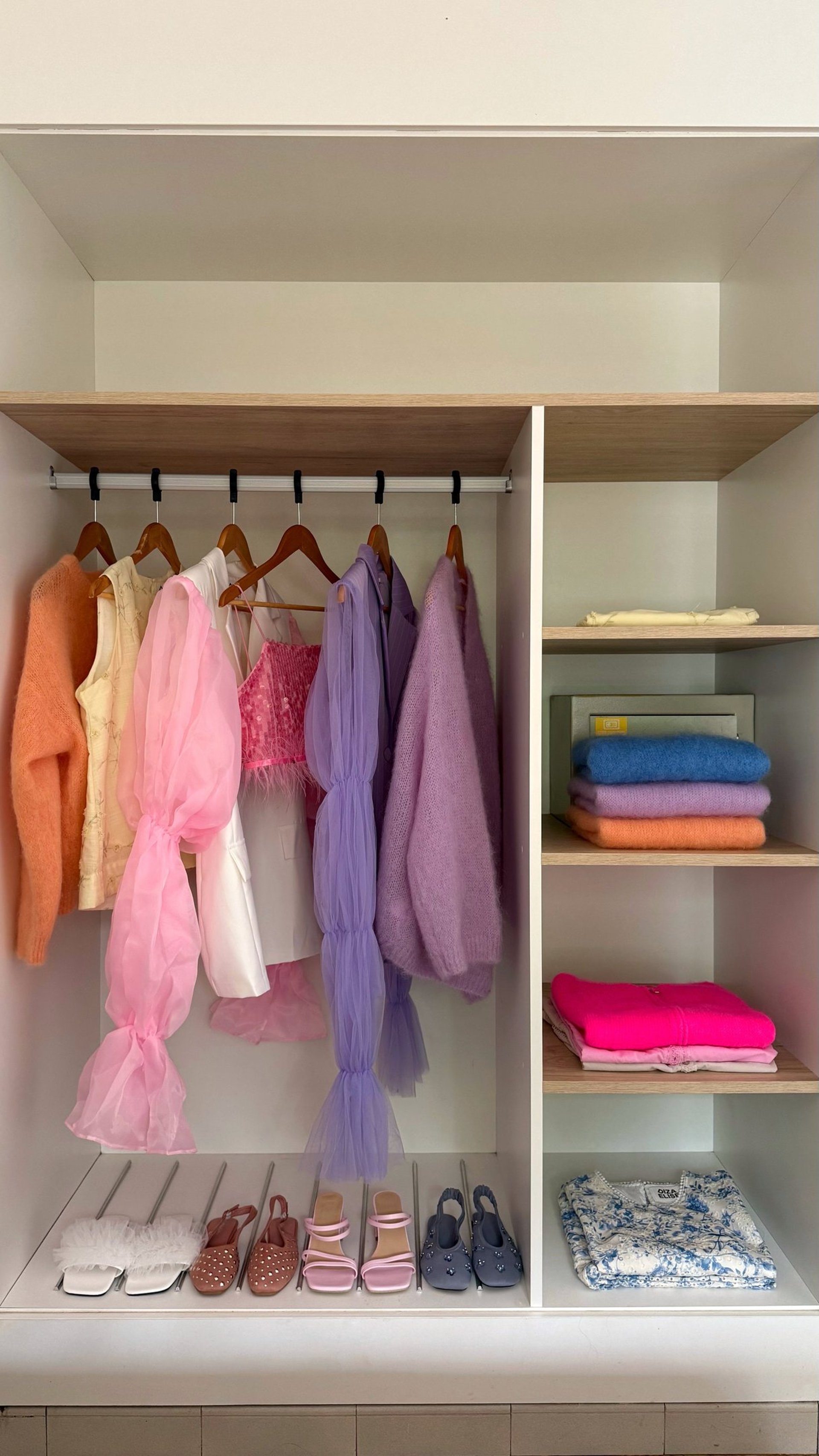 an abstract photo of a curved building with a blue sky in the background