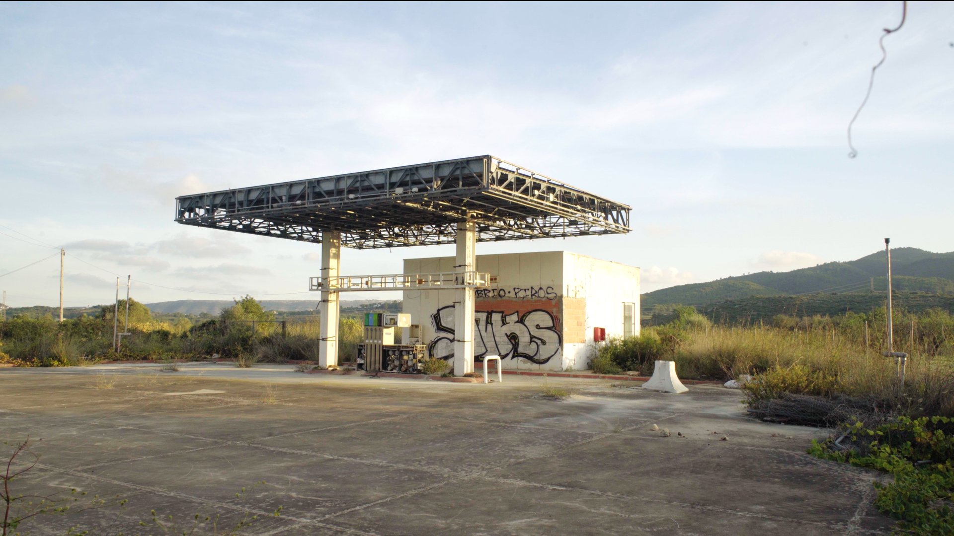 an aerial view of a city intersection with cars