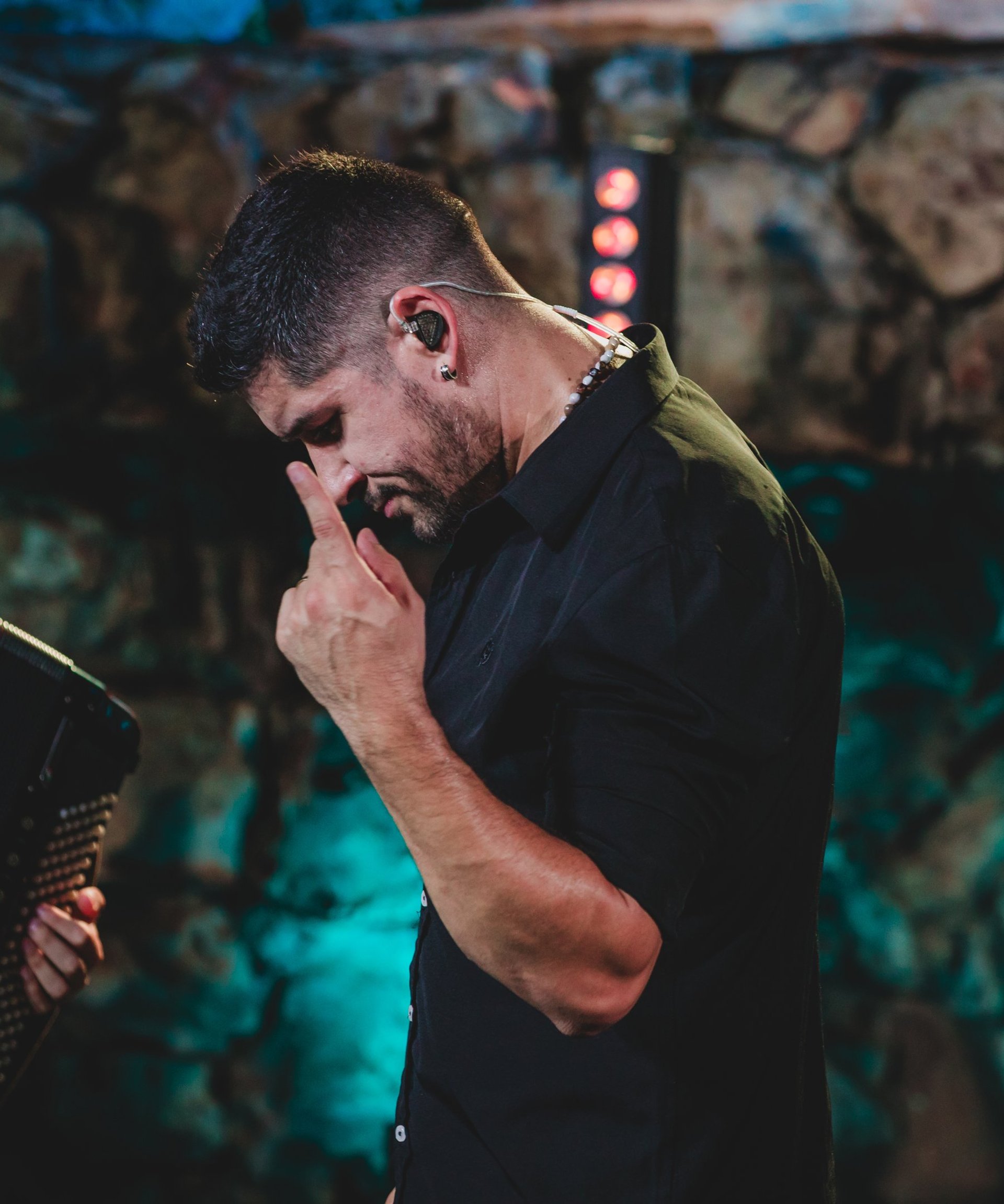 man playing guitar on stage
