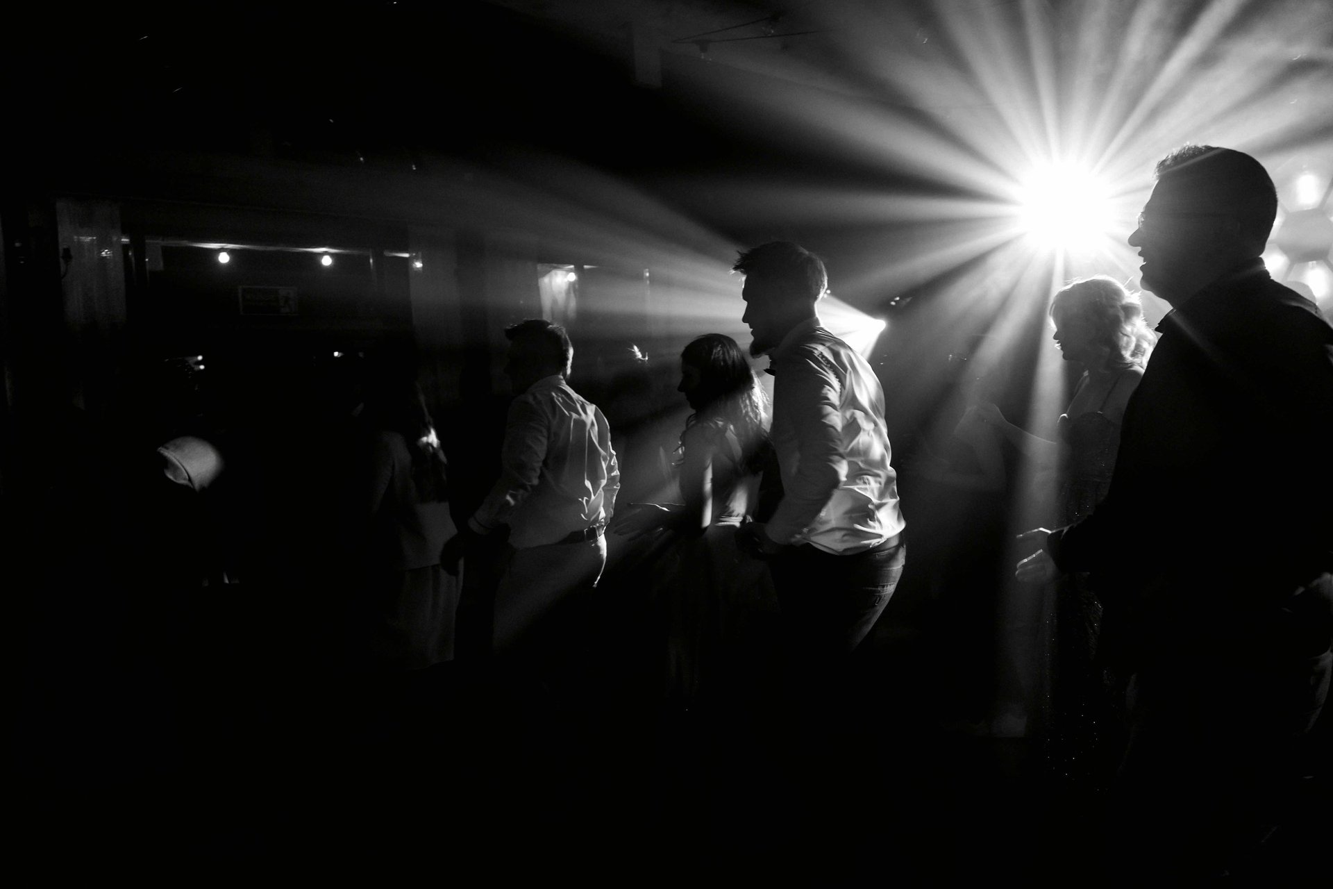 an abstract photo of a curved building with a blue sky in the background
