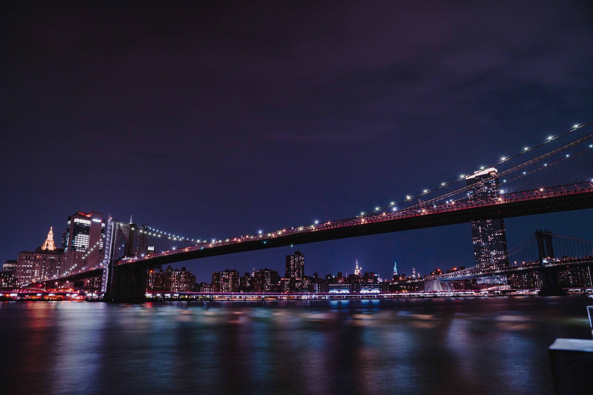 an abstract photo of a curved building with a blue sky in the background
